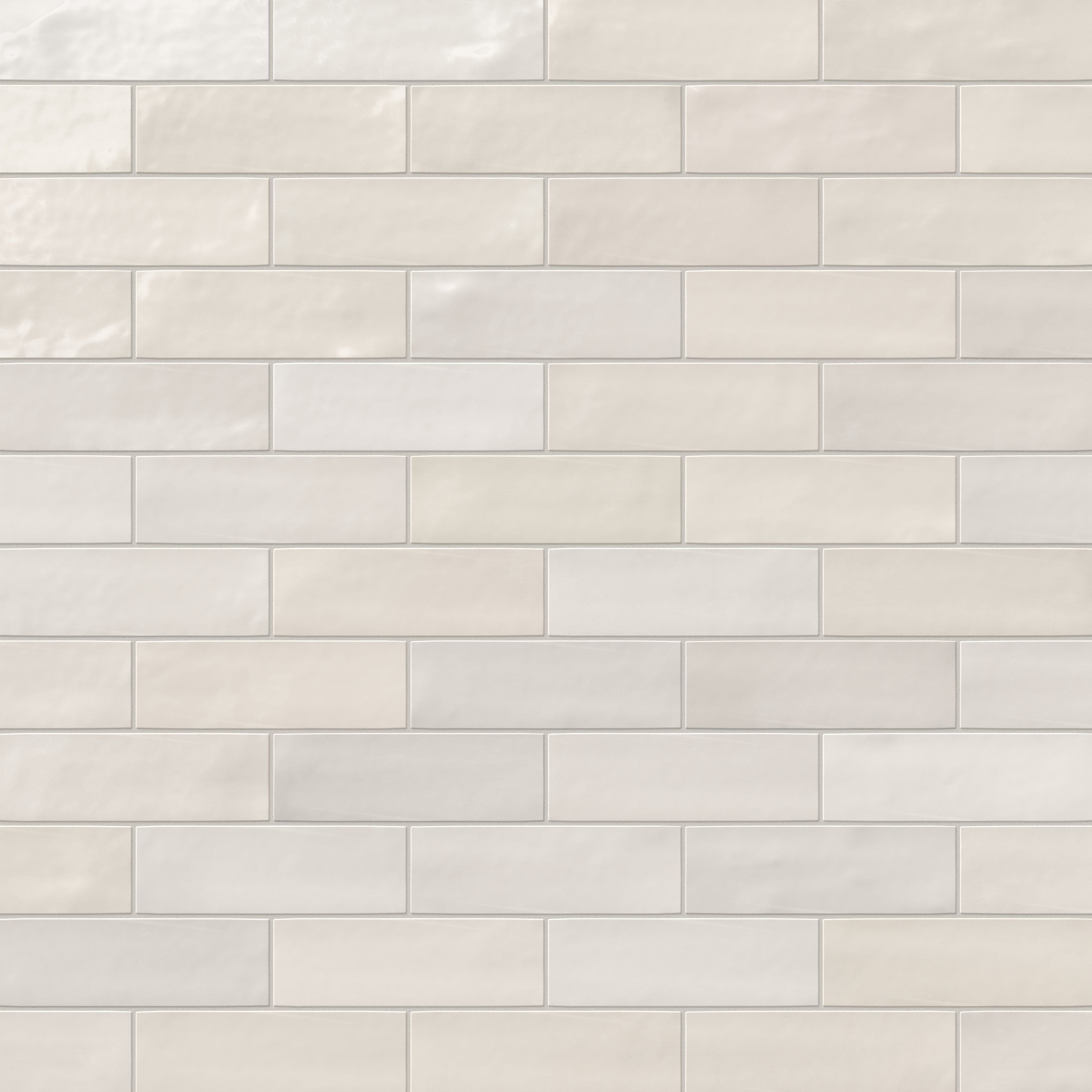 Jojo subway tile in Ivory arranged in a classic brick pattern, showcasing a glossy finish and clean, timeless appeal