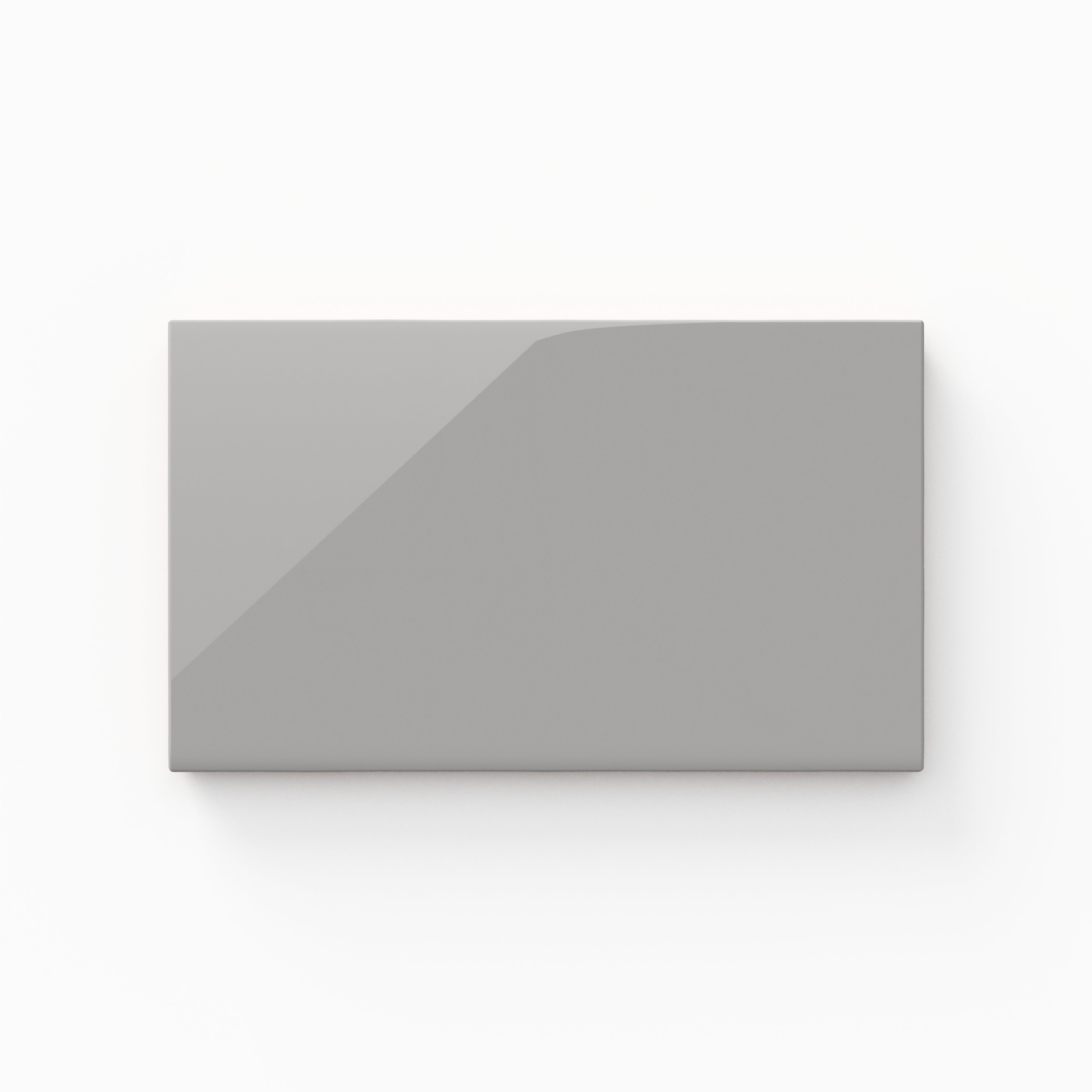 A 4x7 ceramic tile in light gray, featuring a glossy finish, reflective surface, and a sleek modern look.