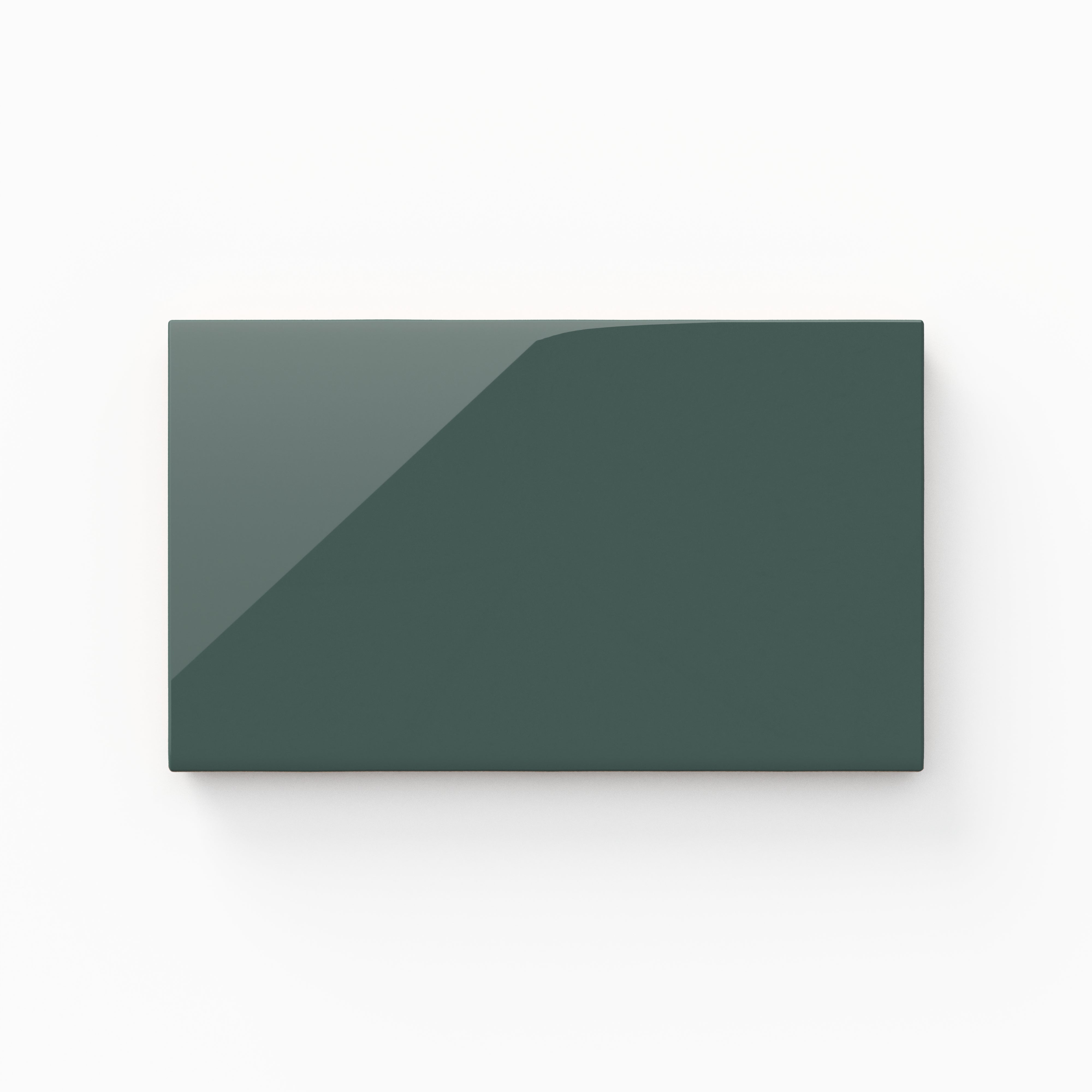 A 4x7 ceramic tile in forest green, featuring a glossy finish, reflective surface, and a sleek modern look.