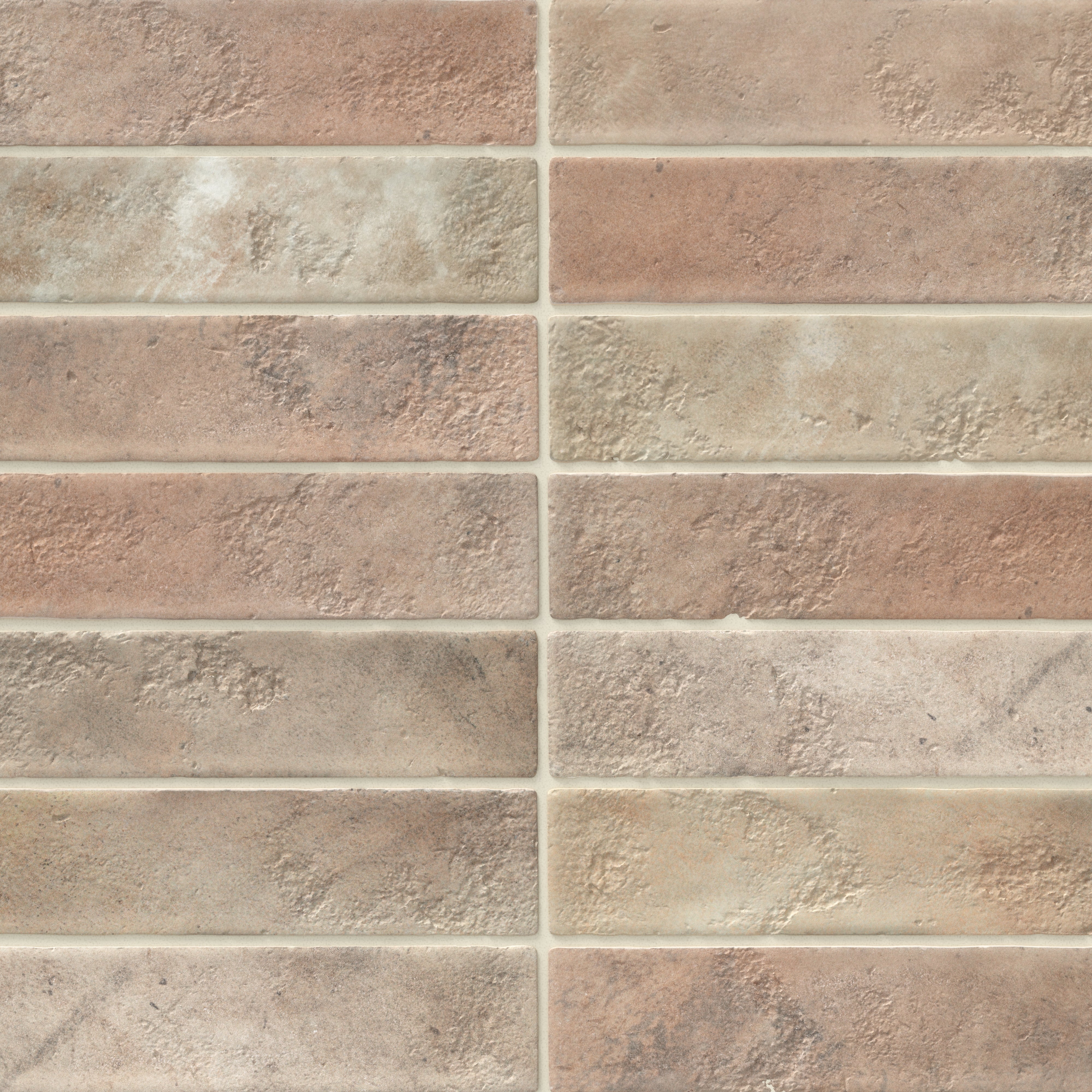 Matte 2x10 brick-look ceramic tile in warm earthy tones of brown, beige, and gray with a textured, weathered finish for a rustic natural appeal.