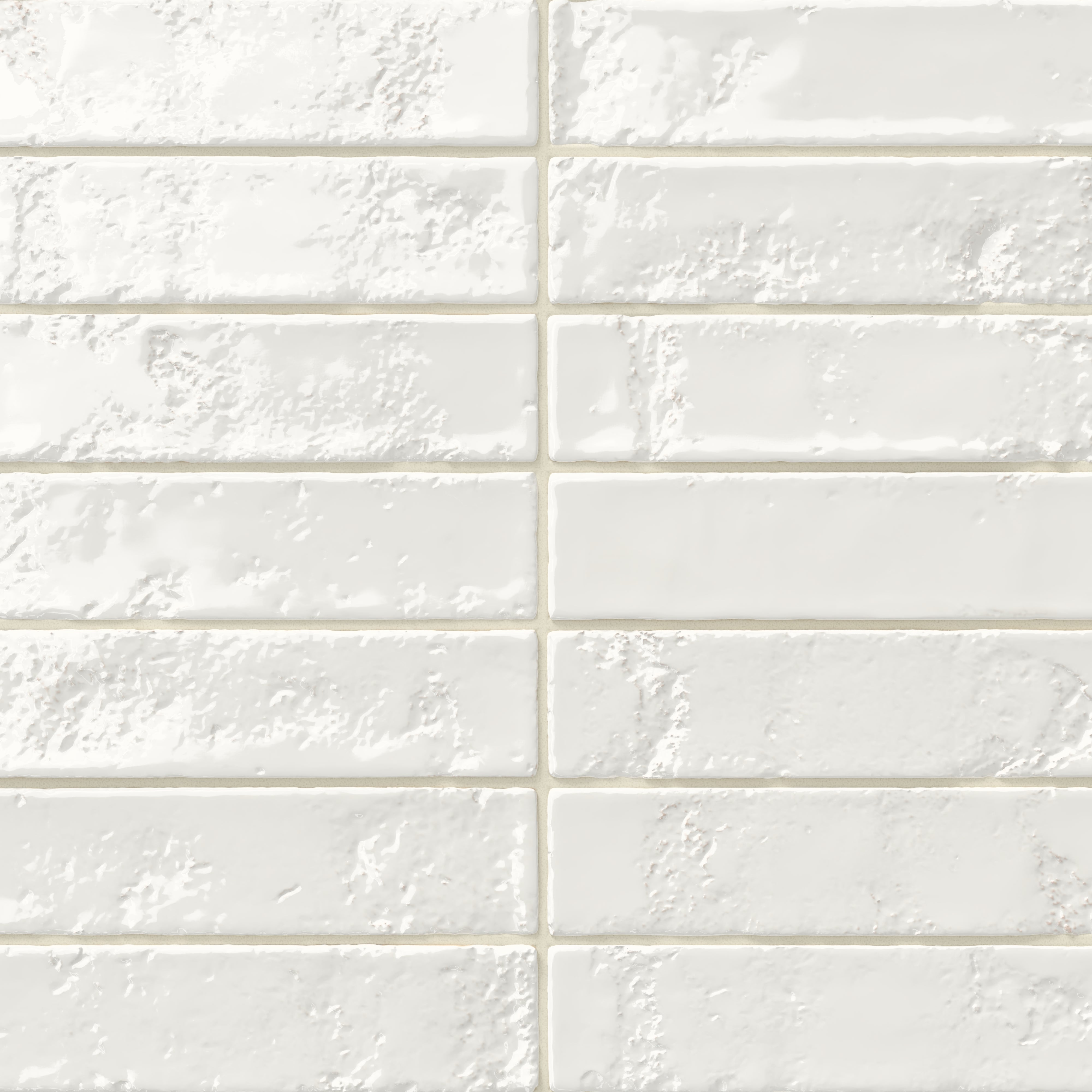 Glossy white 2x10 ceramic subway tile with a slightly textured, uneven surface that adds depth and handcrafted character to the finish.