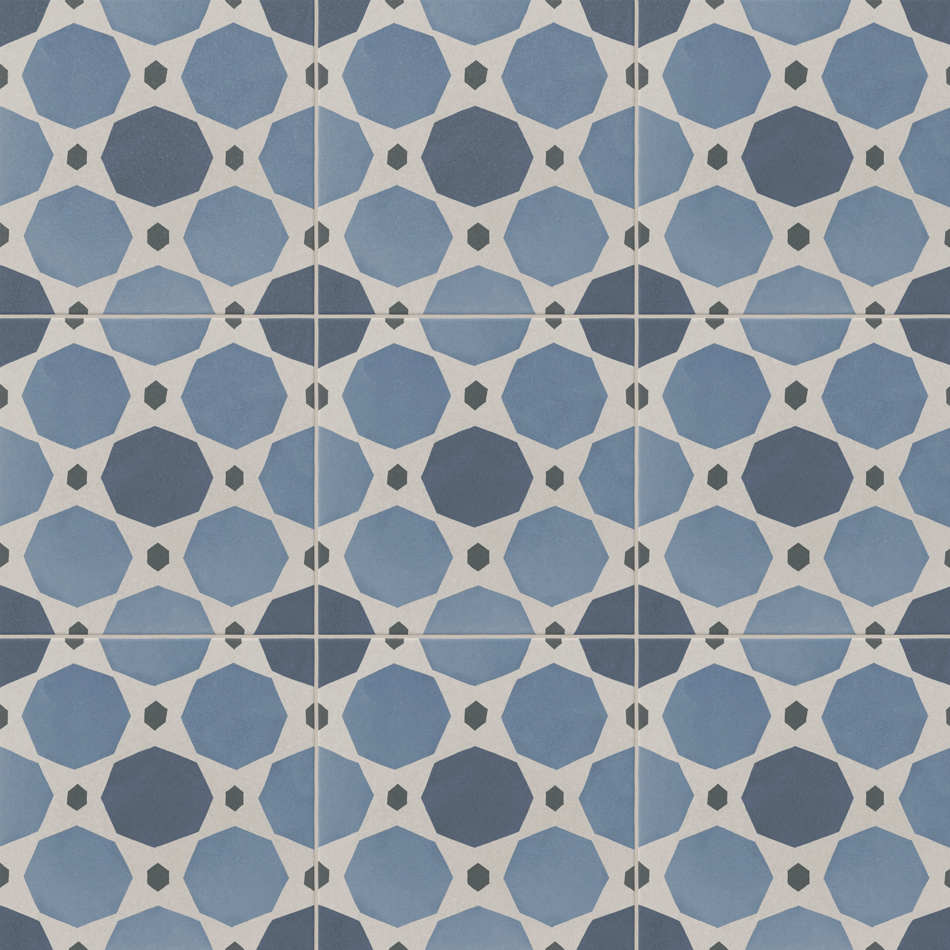 An 8x8 matte porcelain decorative tile featuring interlocking octagons in navy and sky blue, connected by off-white diamonds and charcoal hexagons.