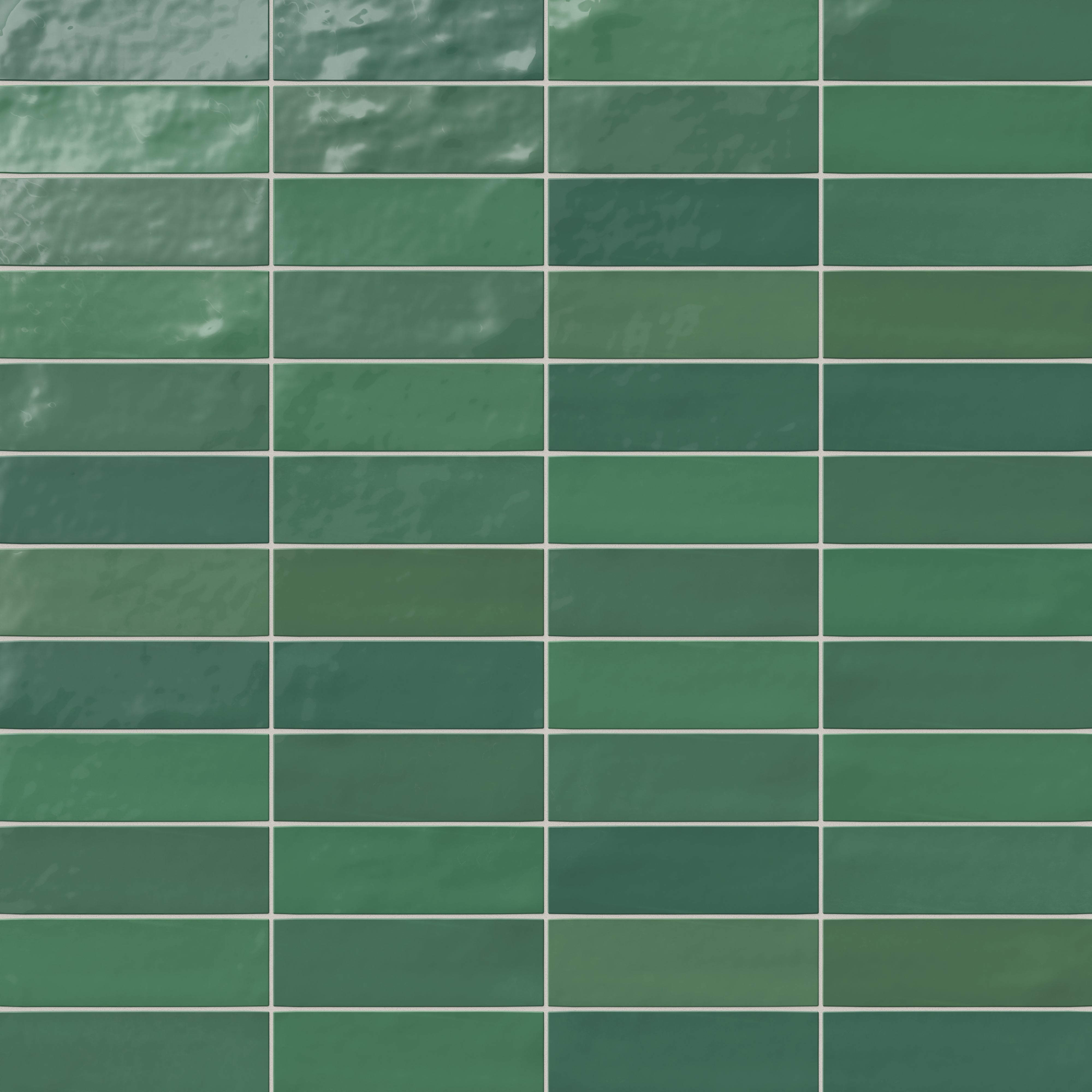 Glossy ceramic 2x8 subway tile in rich emerald green, featuring a handcrafted look with subtle surface variations for added depth and character.