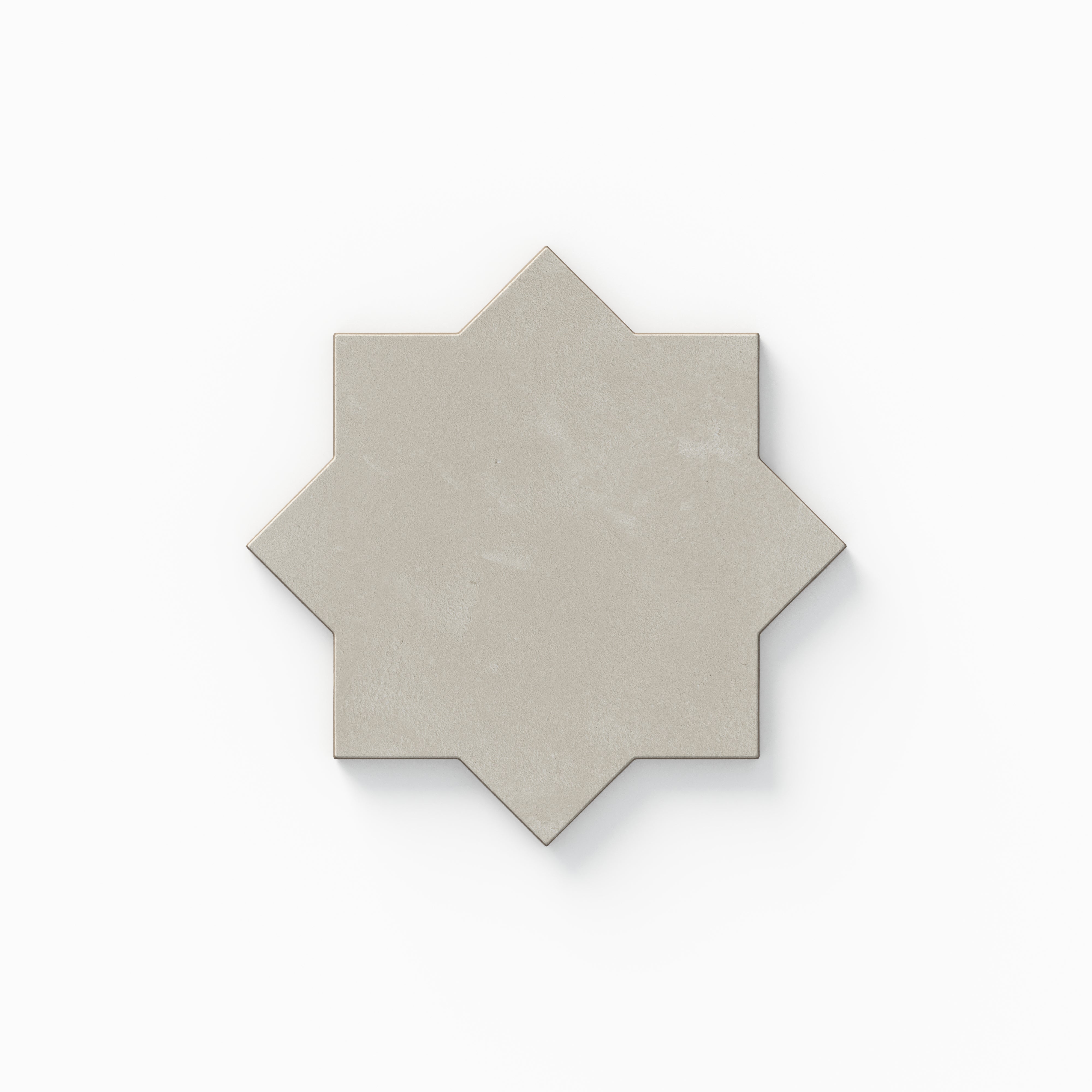 This eight-point star tile from our Isabel 11x11 Matte Porcelain collection highlights light gray coloring, gentle plaster-like texture, and a powdery surface with an organically aged feel.