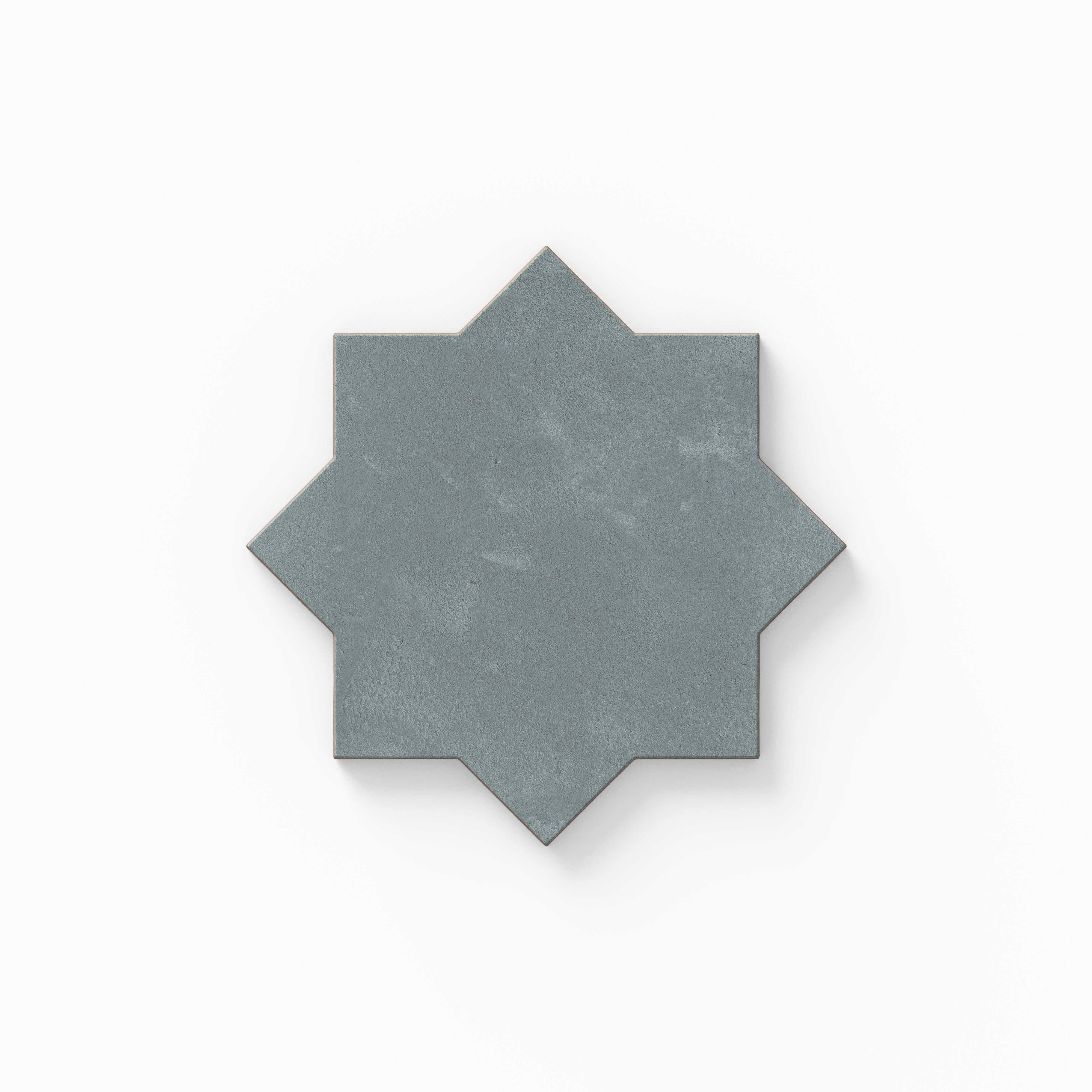 Part of our Isabel 11x11 Matte Porcelain Star and Cross set, this eight-point star tile shows blue hues with soft cement texture and a powdery finish inspired by aged terracotta.