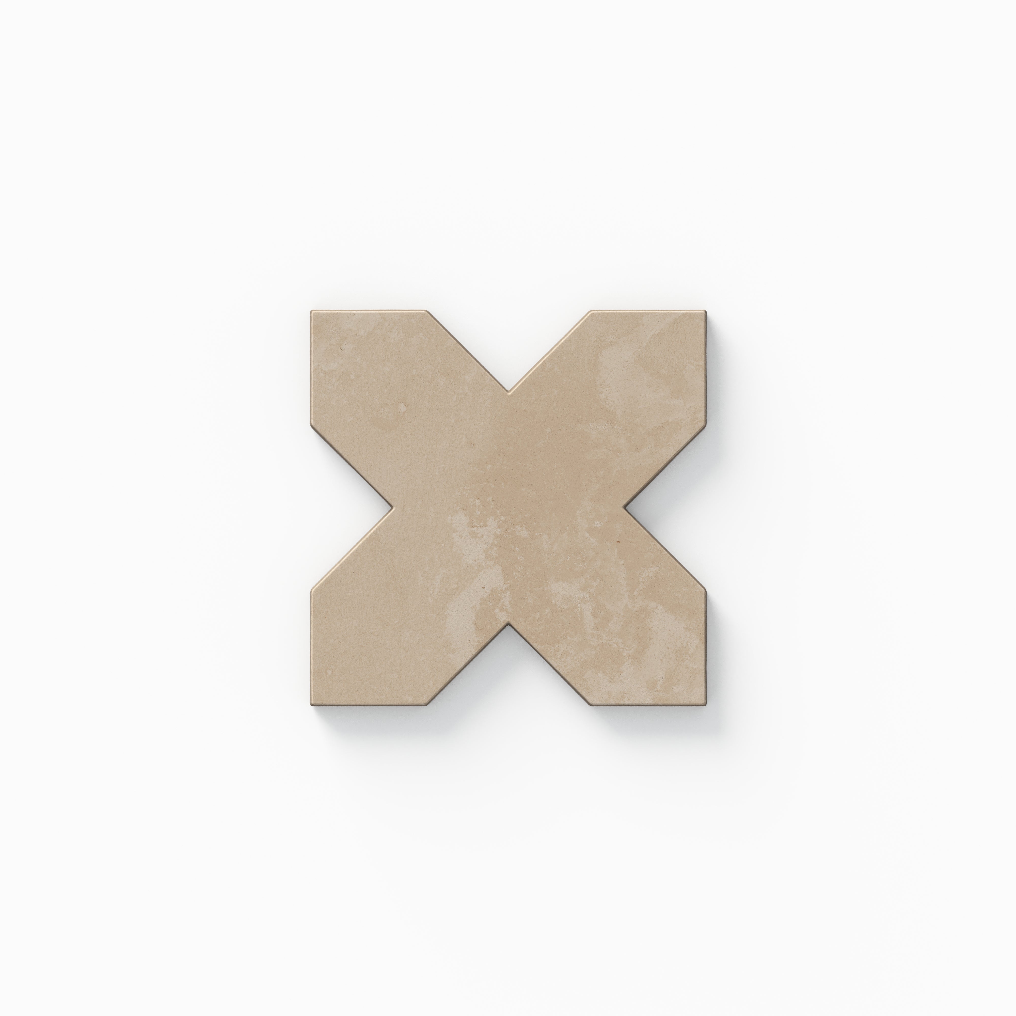 This decorative cross tile from our Isabel 11x11 Matte Porcelain collection shows beige coloring with gentle pink warmth, subtle cement textures, and a soft, powdery surface.