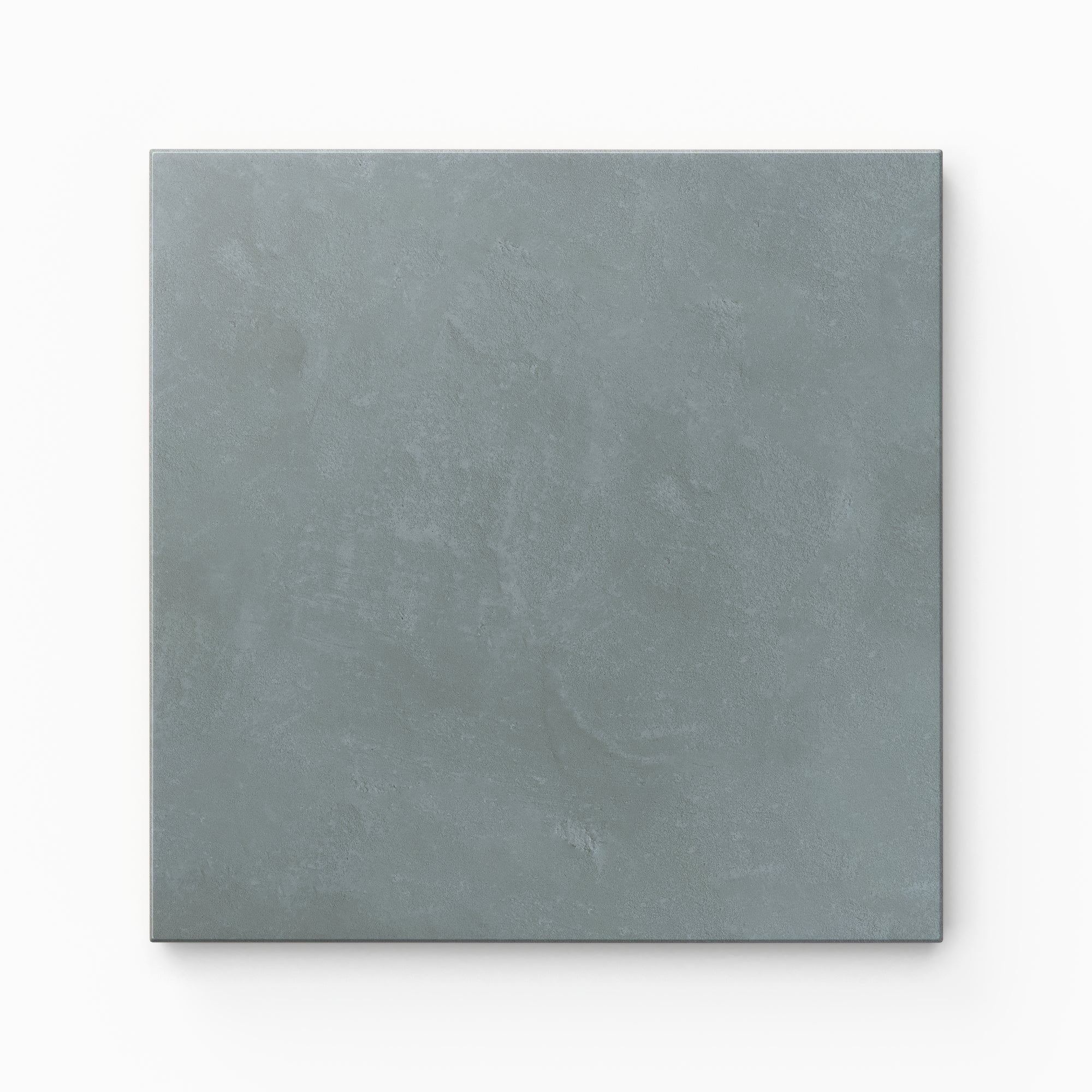 Isabel 6x6 Matte Porcelain Tile in Slate highlights quiet blue shading in a balanced square form, finished with a light cement-plaster texture and a soft matte glaze.