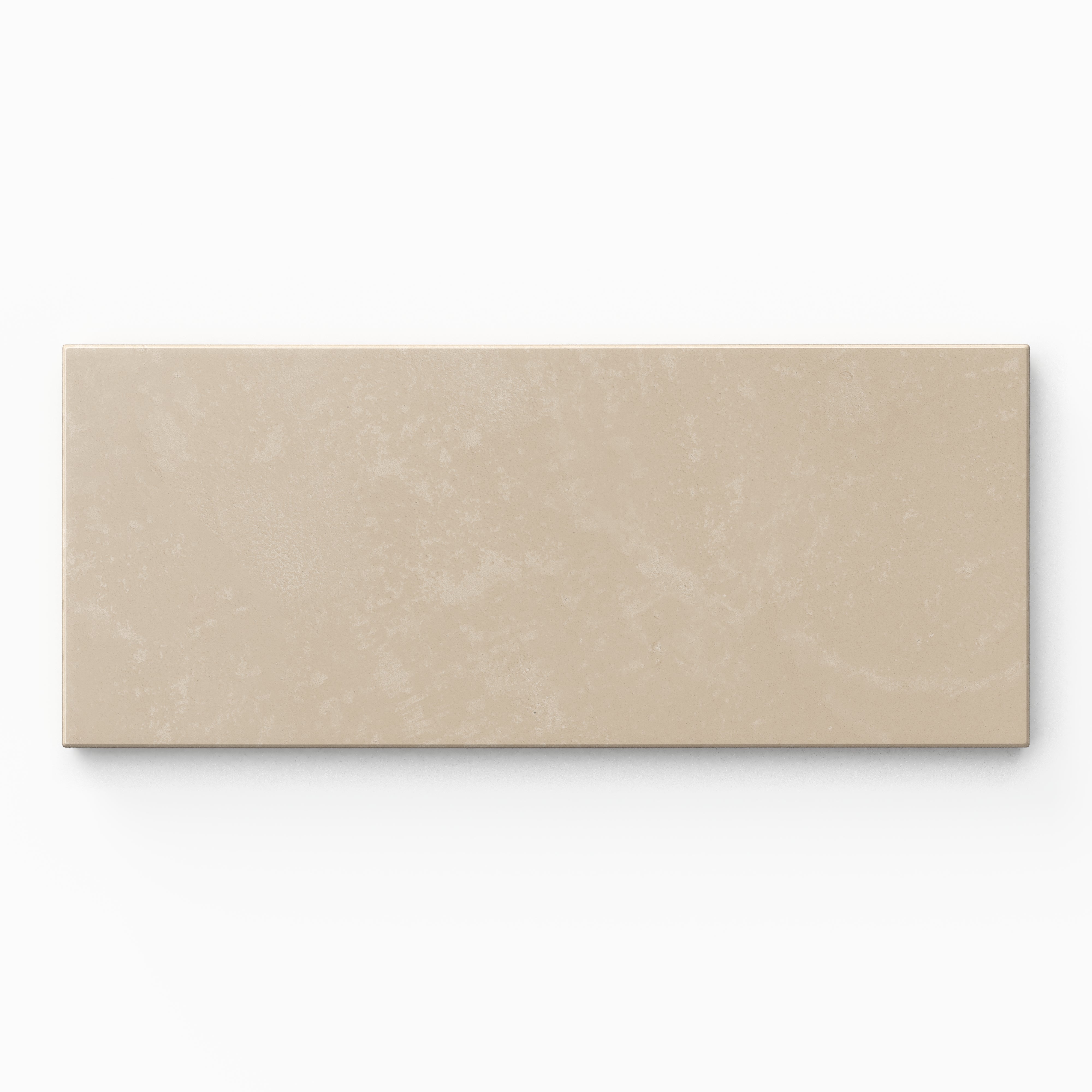 Isabel 2.5x12 Matte Porcelain Tile in Bone features warm beige coloring with soft tonal variation, an elongated subway shape, and subtle cement-plaster texture finished with a powdery matte glaze.