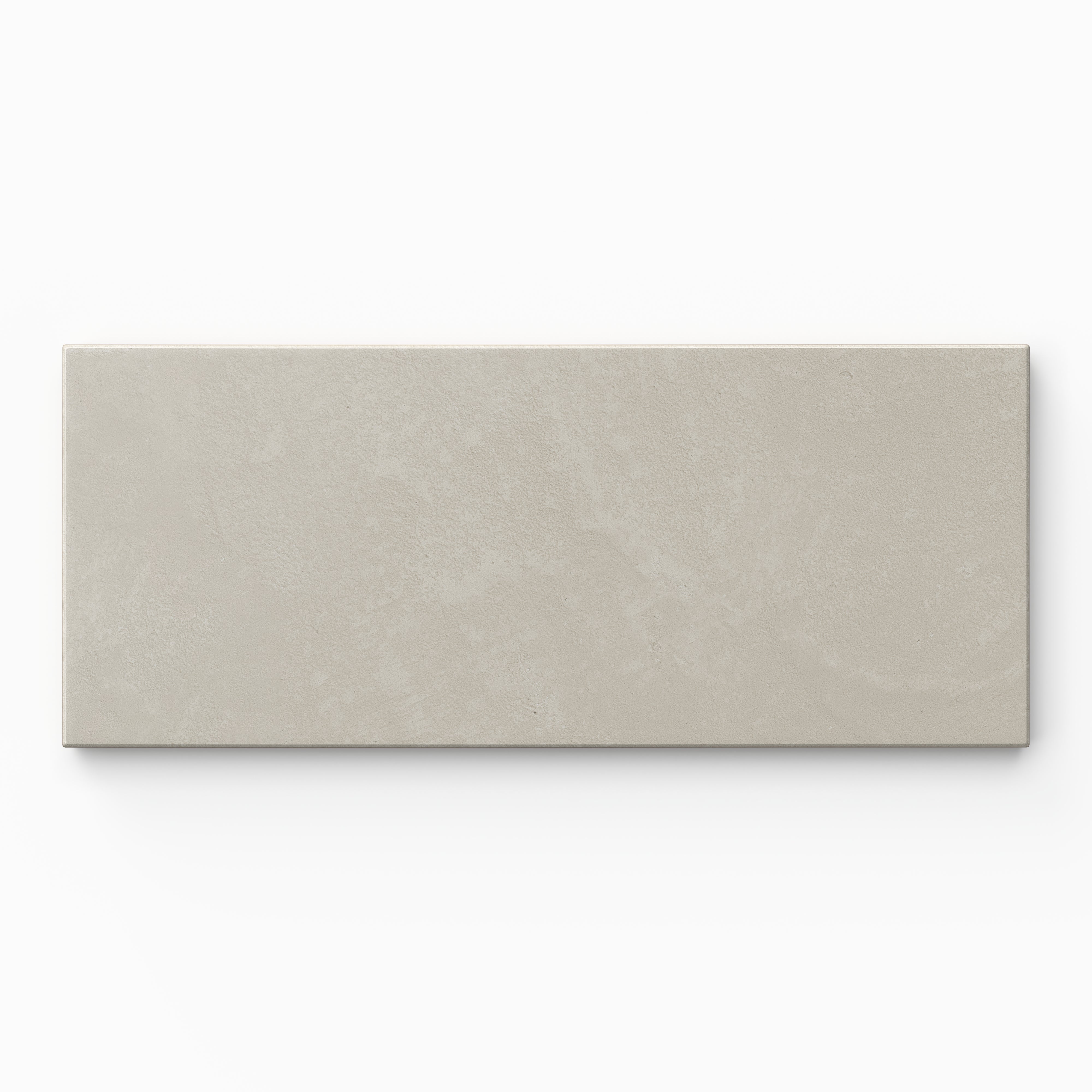 Isabel 2.5x12 Matte Porcelain Tile in Dove shows calm light gray coloring, a slim subway profile, and fine cement-plaster texture softened by a smooth, powder-matte finish.