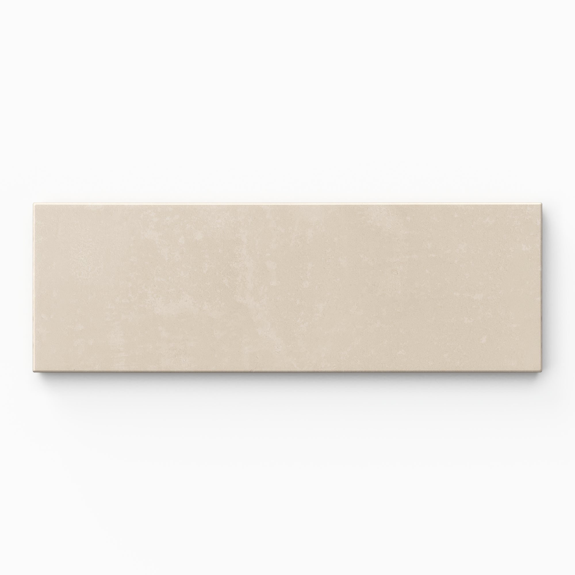 Isabel 2x6 Matte Porcelain Tile in Cream features soft grayish beige tones with gentle color variation, subtle cement-plaster texture, and a smooth powdery matte finish.