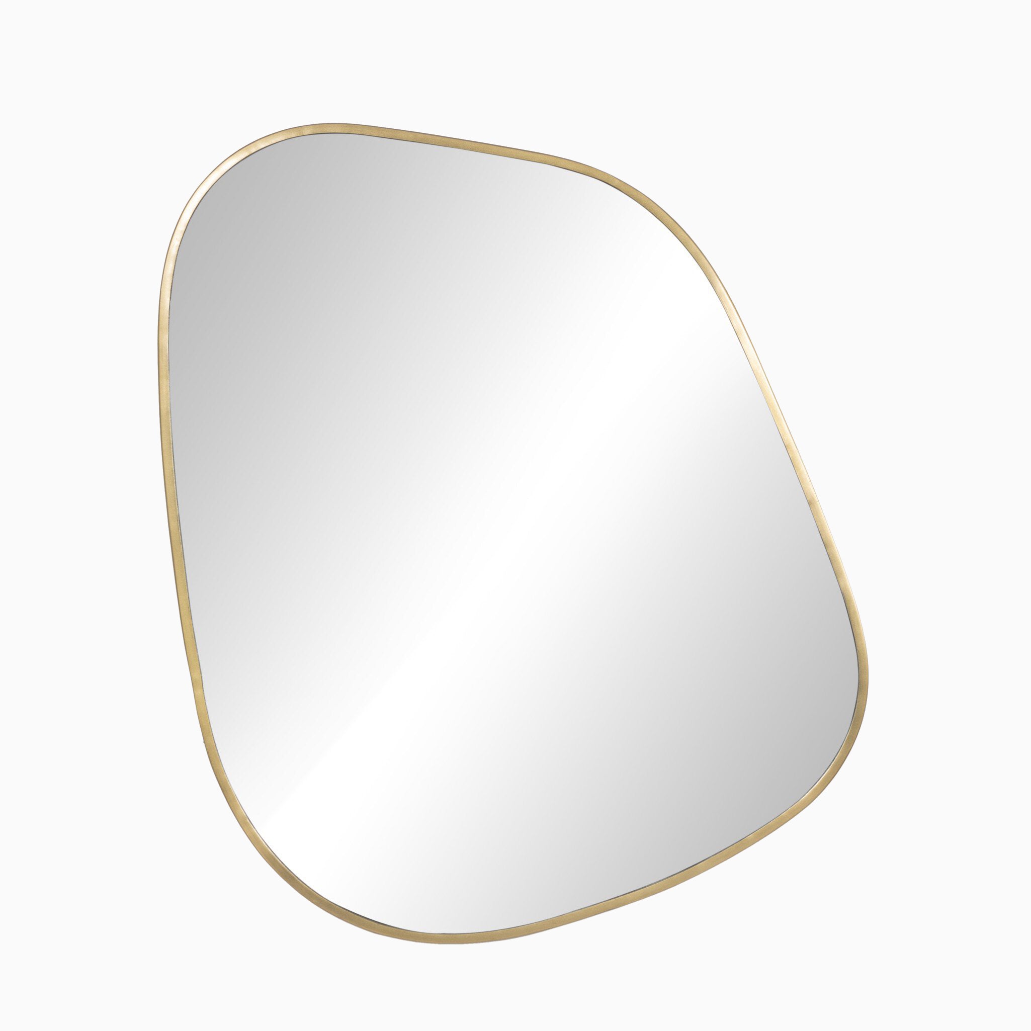 Asymmetrical wall mirror framed in antique brass, blending modern curves with vintage-inspired elegance.