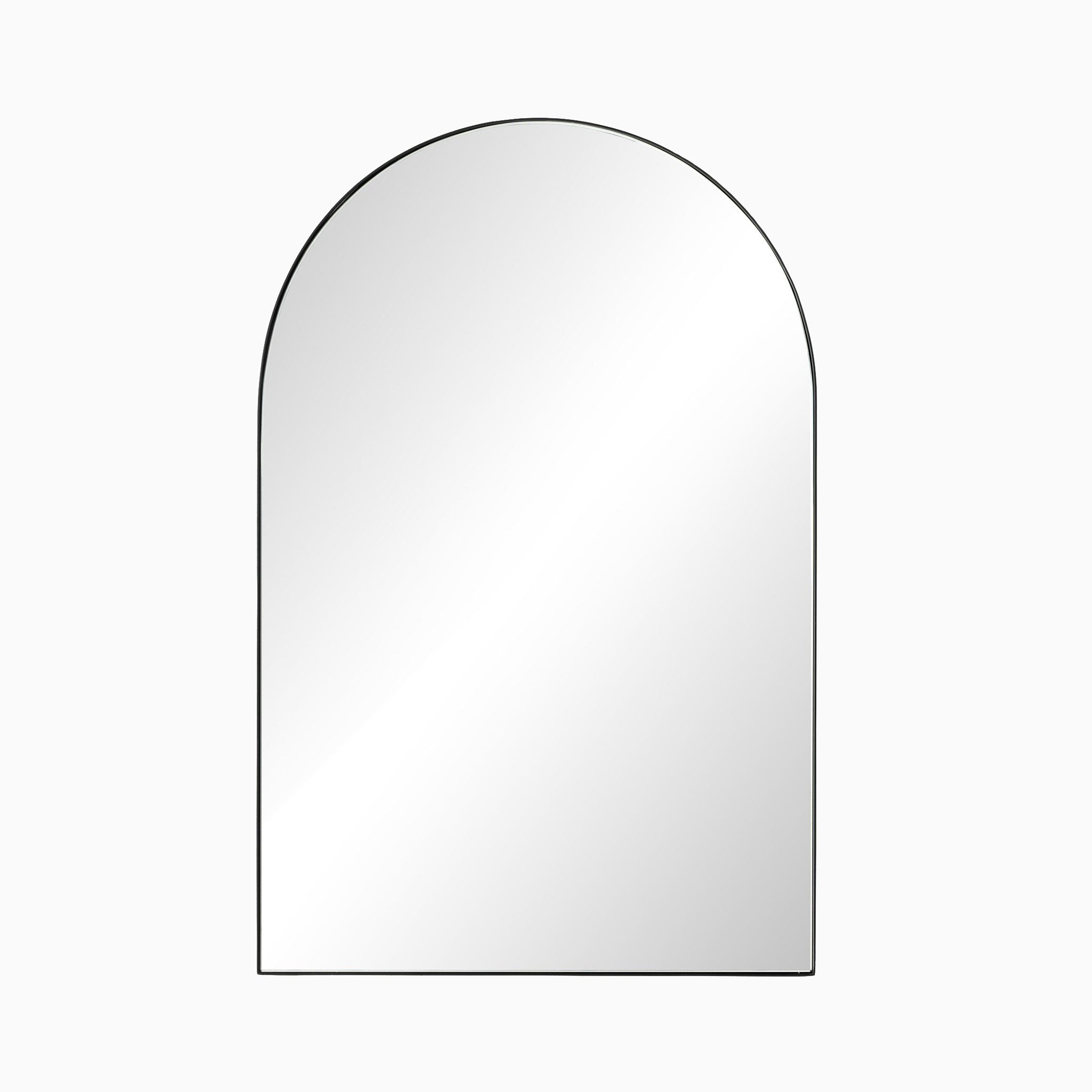 Arched matte black-framed mirror with a minimalist design, offering a sleek, modern accent to any interior wall.