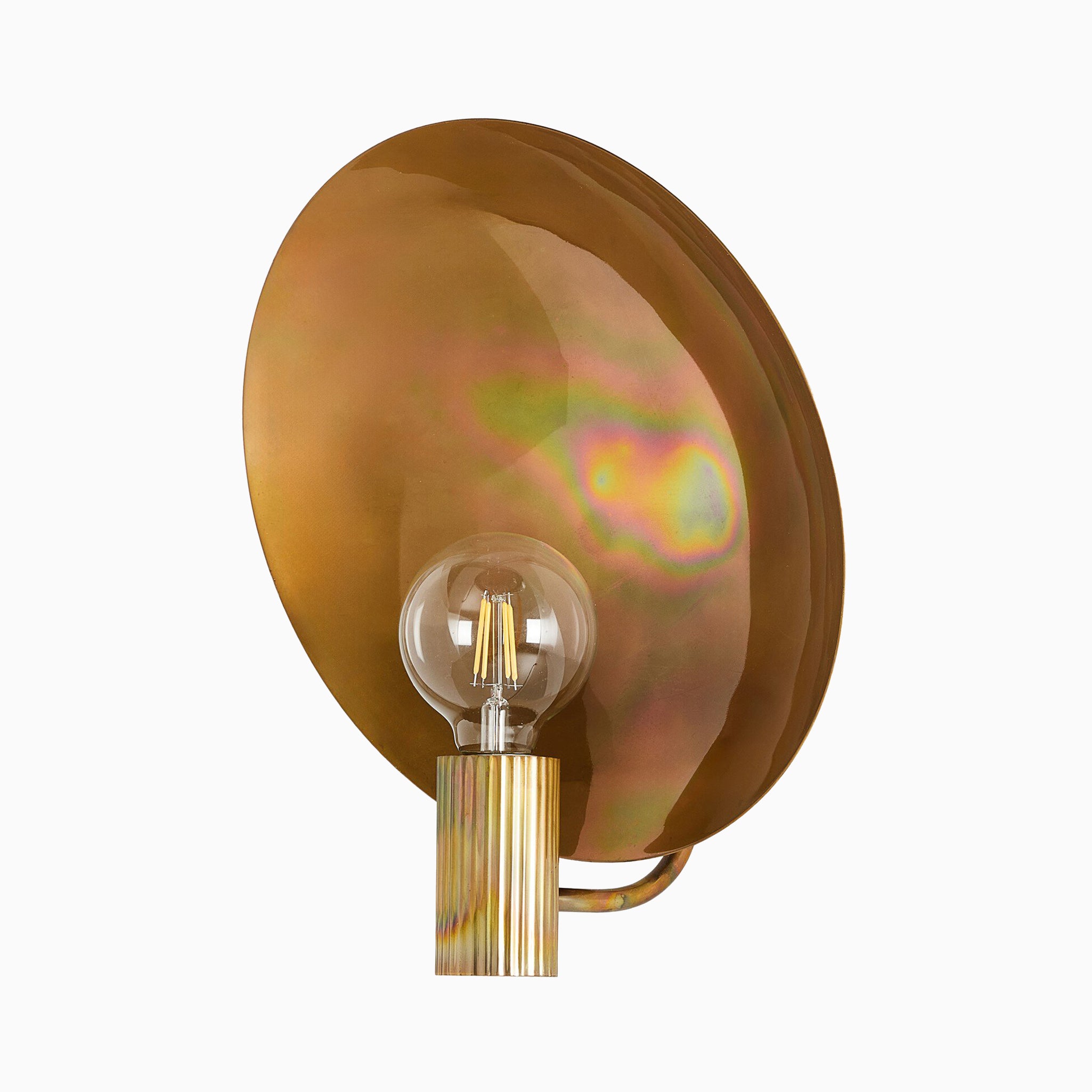 Modern wall sconce with a ribbed brass socket, exposed bulb, and a large, iridescent burnt brass reflector with a warm, multitone finish.