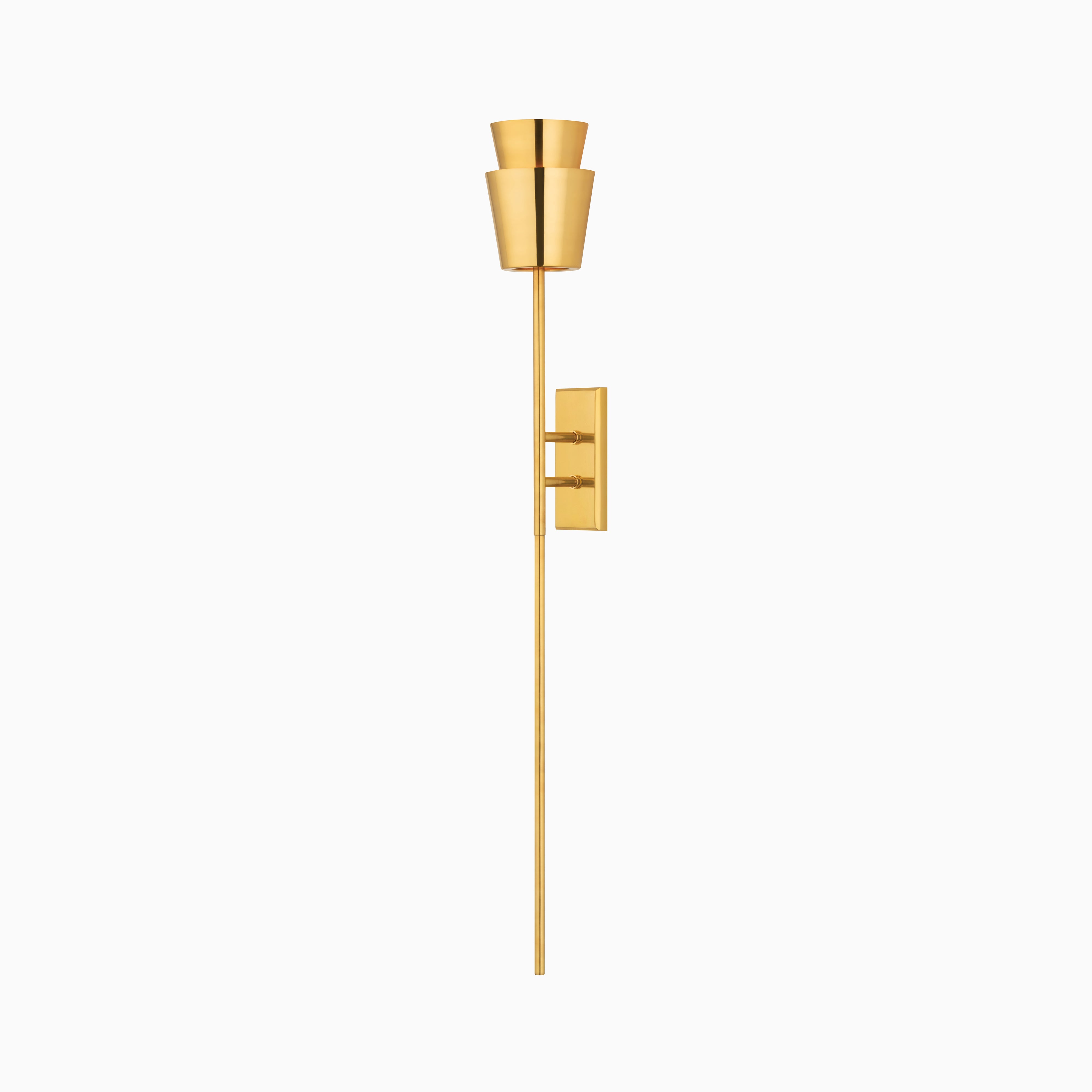 Our Kali Wall Sconce in Vintage Brass features a slender rod with layered cone shades, creating a soft upward glow that's ideal for mid-century modern interiors.