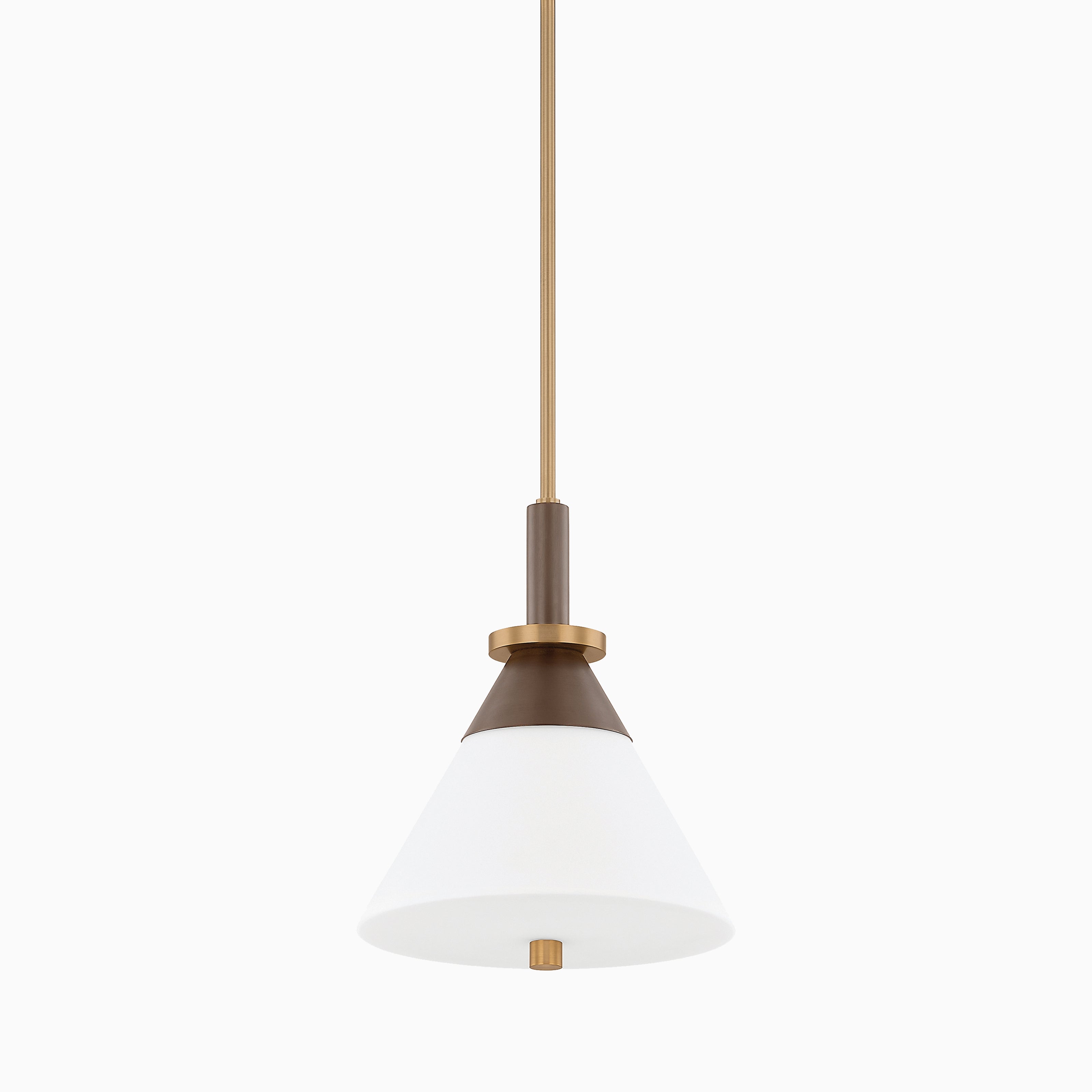 A bold blend of contrast, the Lennie 12” Pendant combines a flared white shade with patina brass and bronze accents, suspended from a sleek vertical rod.