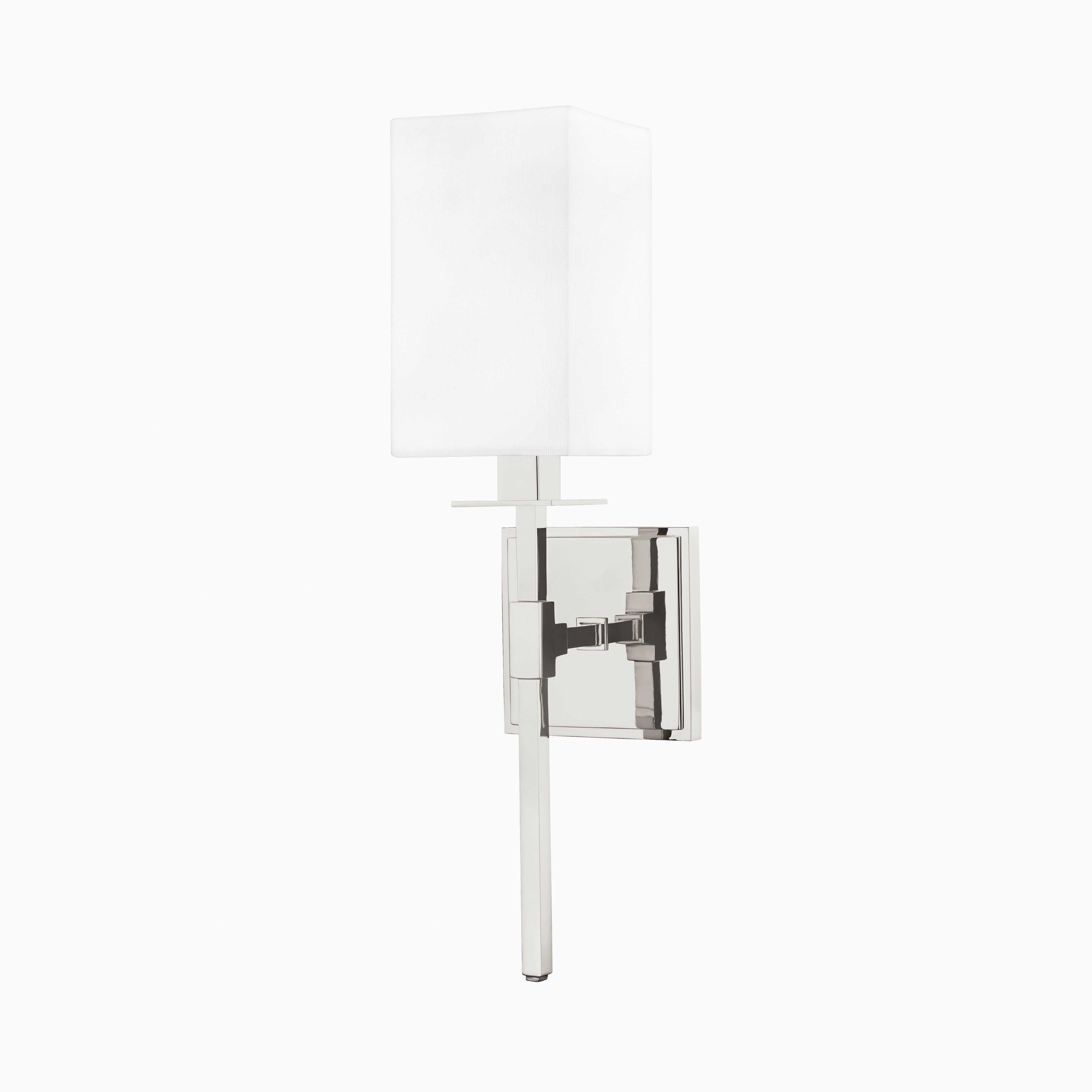 Our Lockhart Wall Sconce in Polished Nickel features a crisp white linen box shade and mirror-like silver finish, blending sharp geometry with a clean, reflective look.