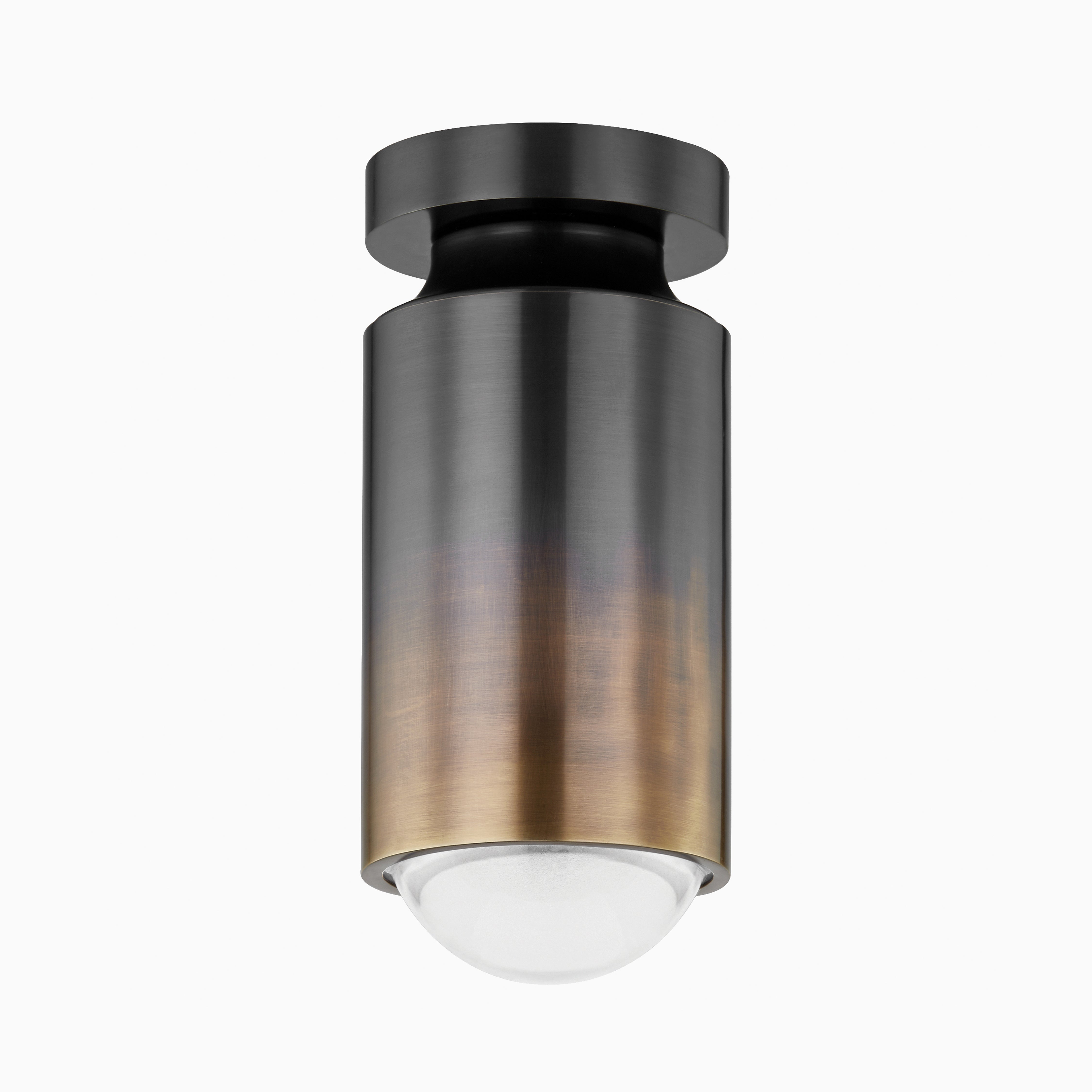 Modern flush mount light with a cylindrical black and brass ombré finish, topped with a rounded frosted diffuser
