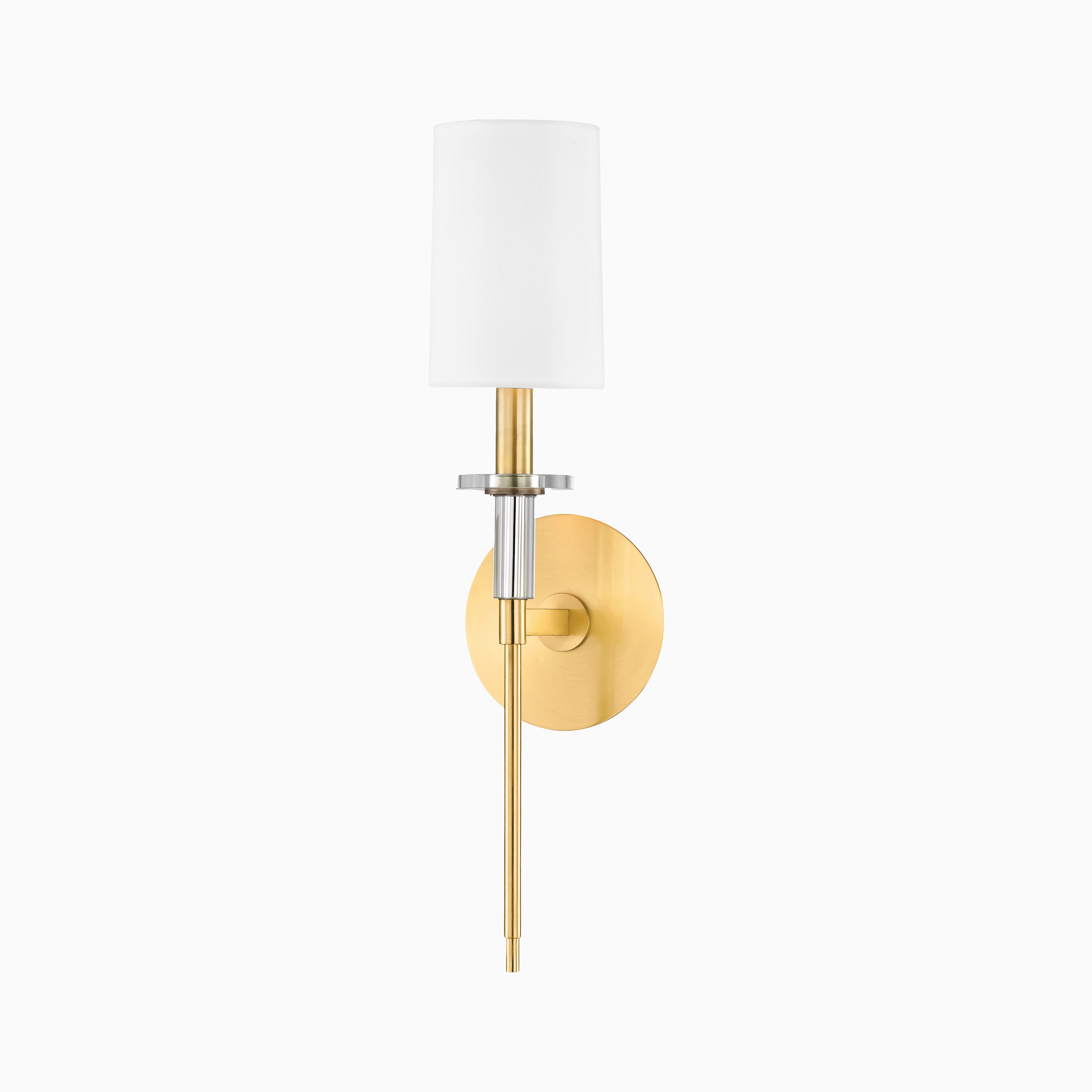 Elegant wall sconce with a white cylindrical linen shade, aged brass finish, and sleek polished nickel accent ring.