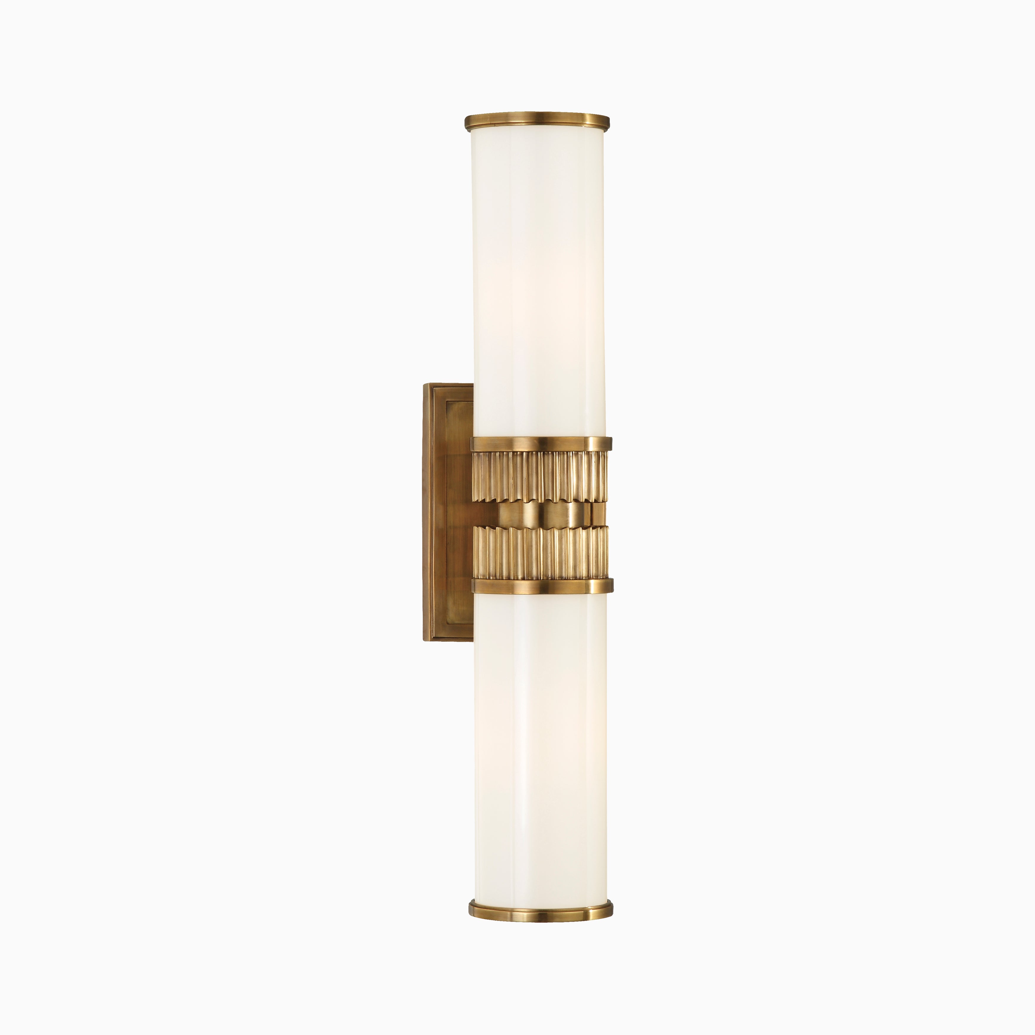 Wall sconce with twin opal glass cylinders and fluted aged brass center band, merging vintage glamour with sculptural symmetry.
