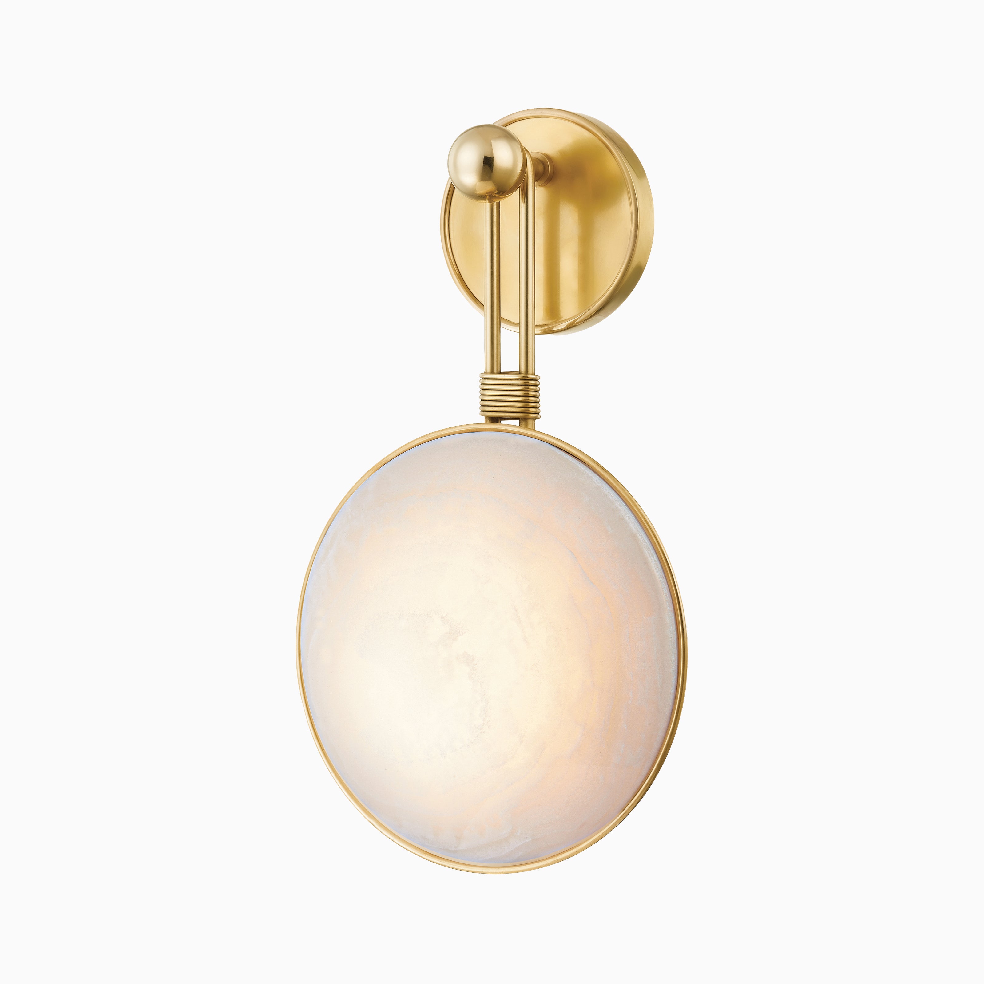 Noelle wall sconce in vintage brass with a glowing onyx disc shade integrated with LED light, radiating soft, elegant illumination.