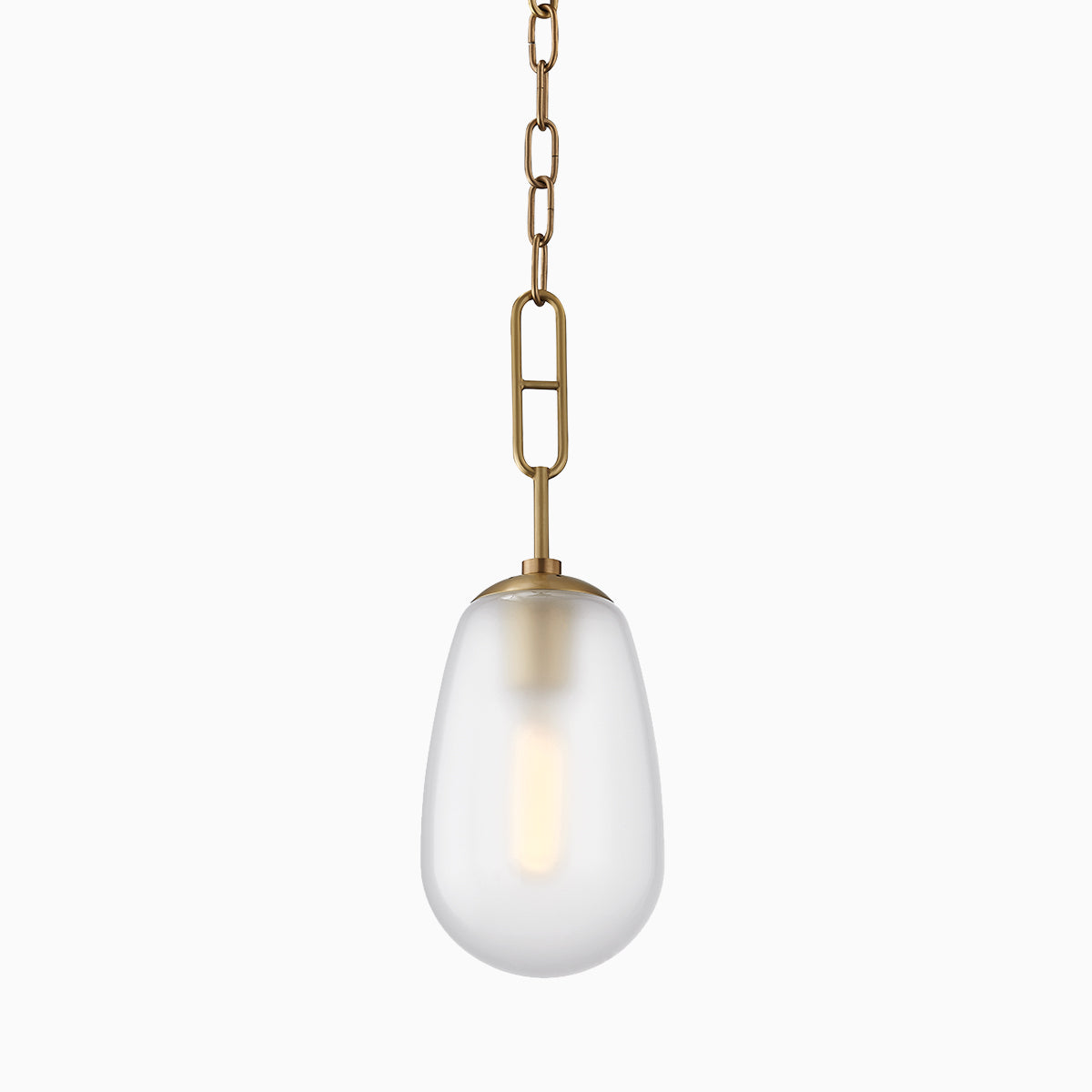 Elegant pendant light with a frosted teardrop glass shade and aged brass chain suspension.