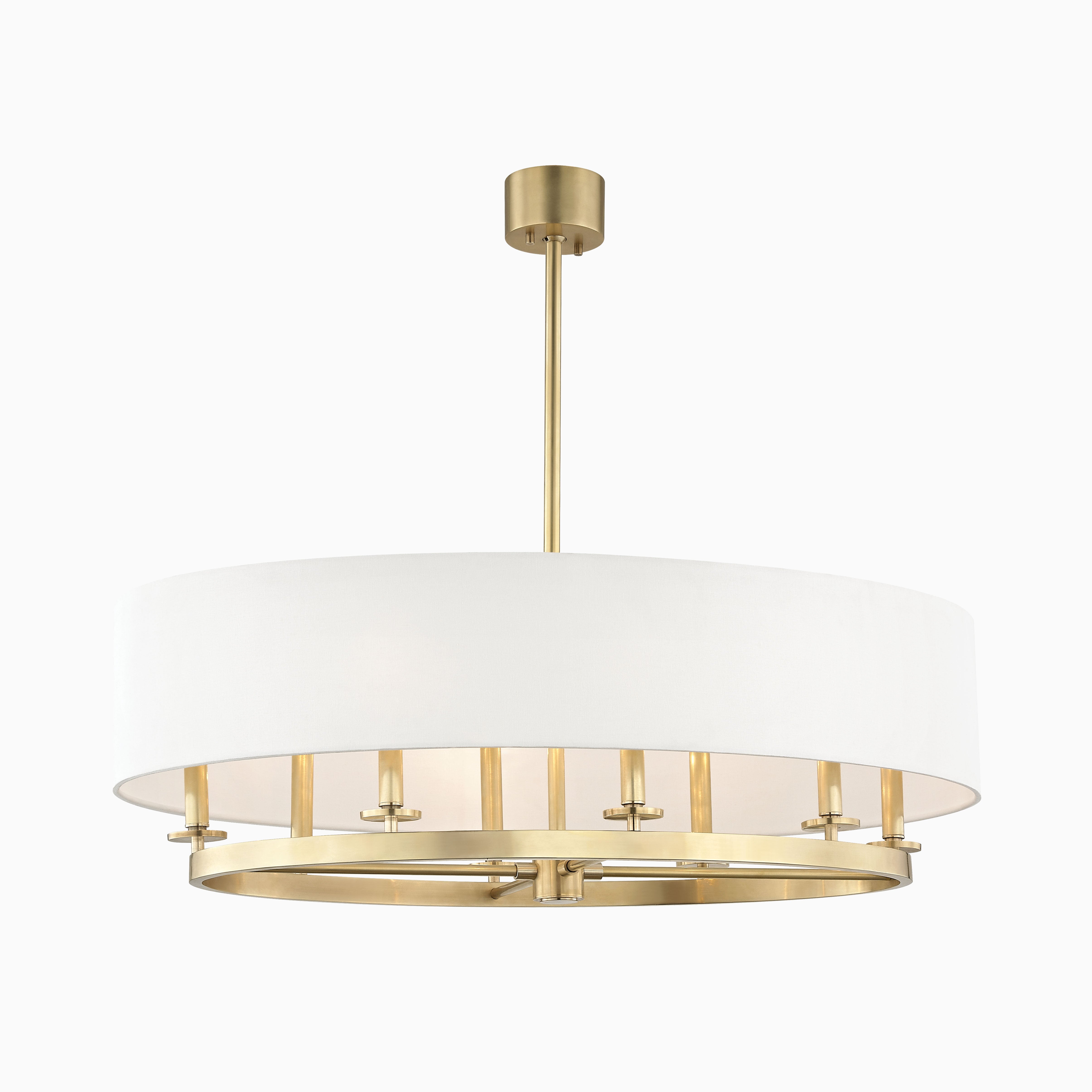 Drum pendant with an off-white linen shade and golden aged brass frame, offering soft, radiant light with timeless warmth and elegance.