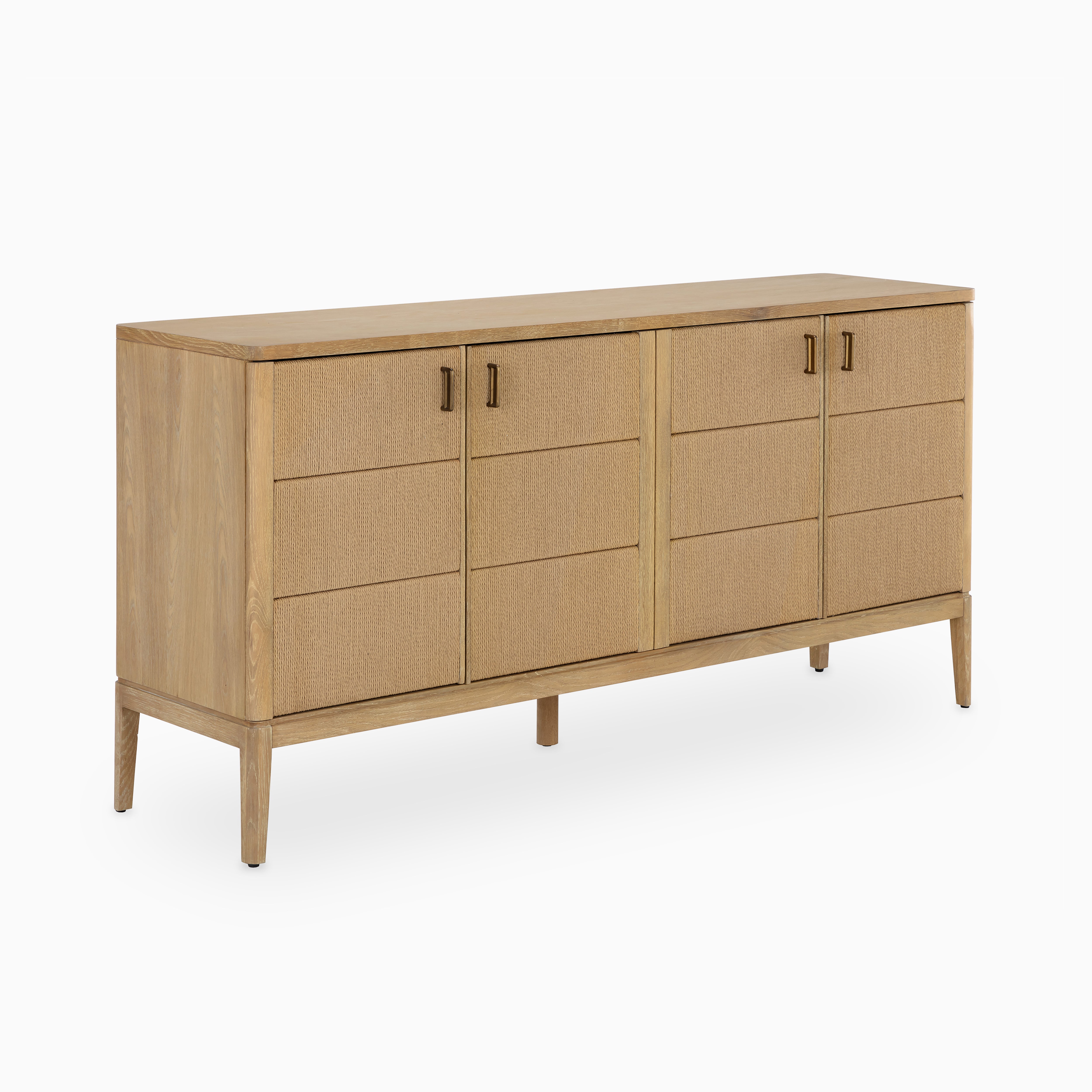 Wooden sideboard with patterned front detailing, bronze pull handles, and elevated frame for a sleek yet organic aesthetic.