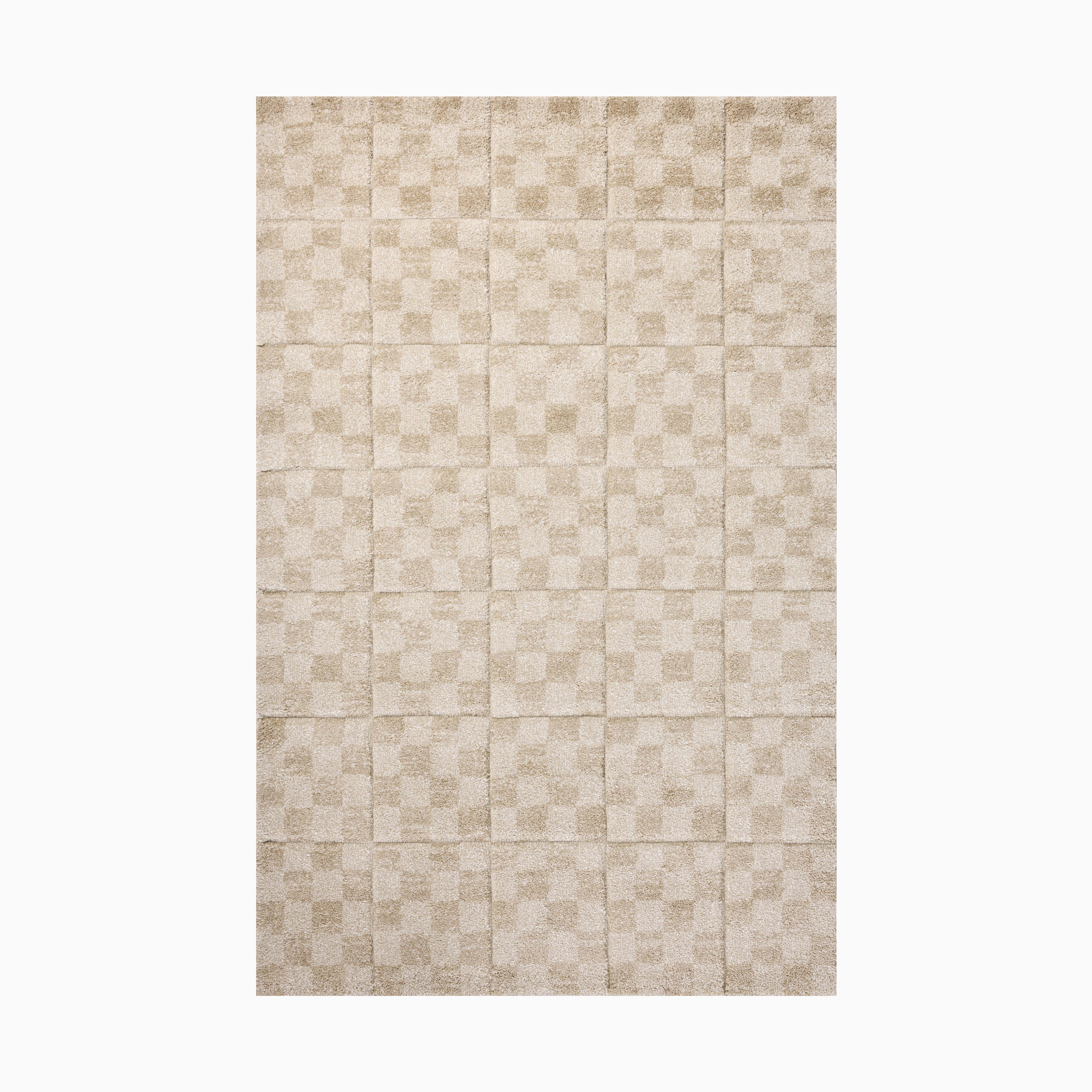 Power loomed area rug from Egypt made of polypropylene, featuring a subtle checkerboard pattern in soft beige tones.