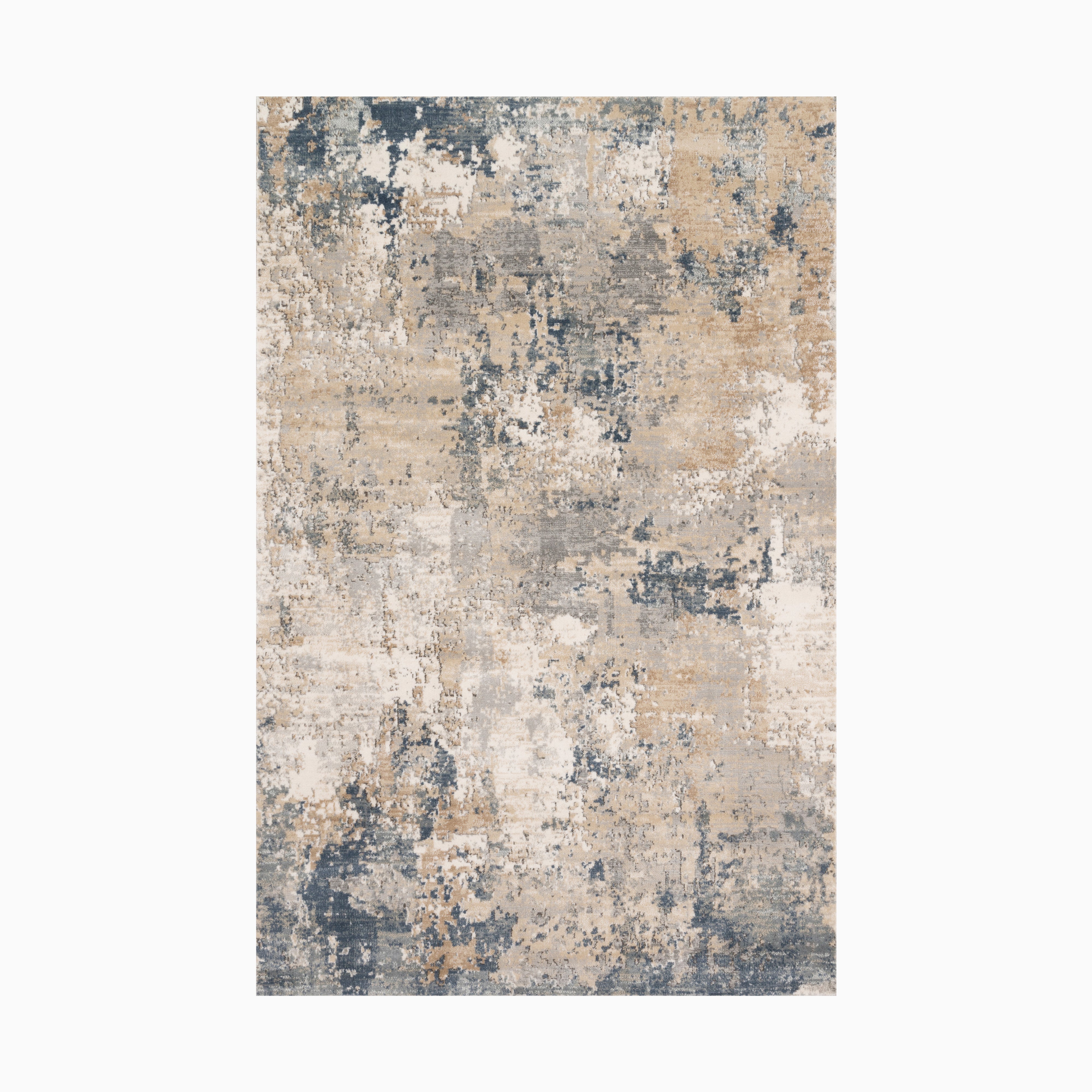 Power loomed area rug made of polypropylene and polyester, featuring a distressed design in beige, ivory, and deep blue tones, blending modern style with vintage charm.