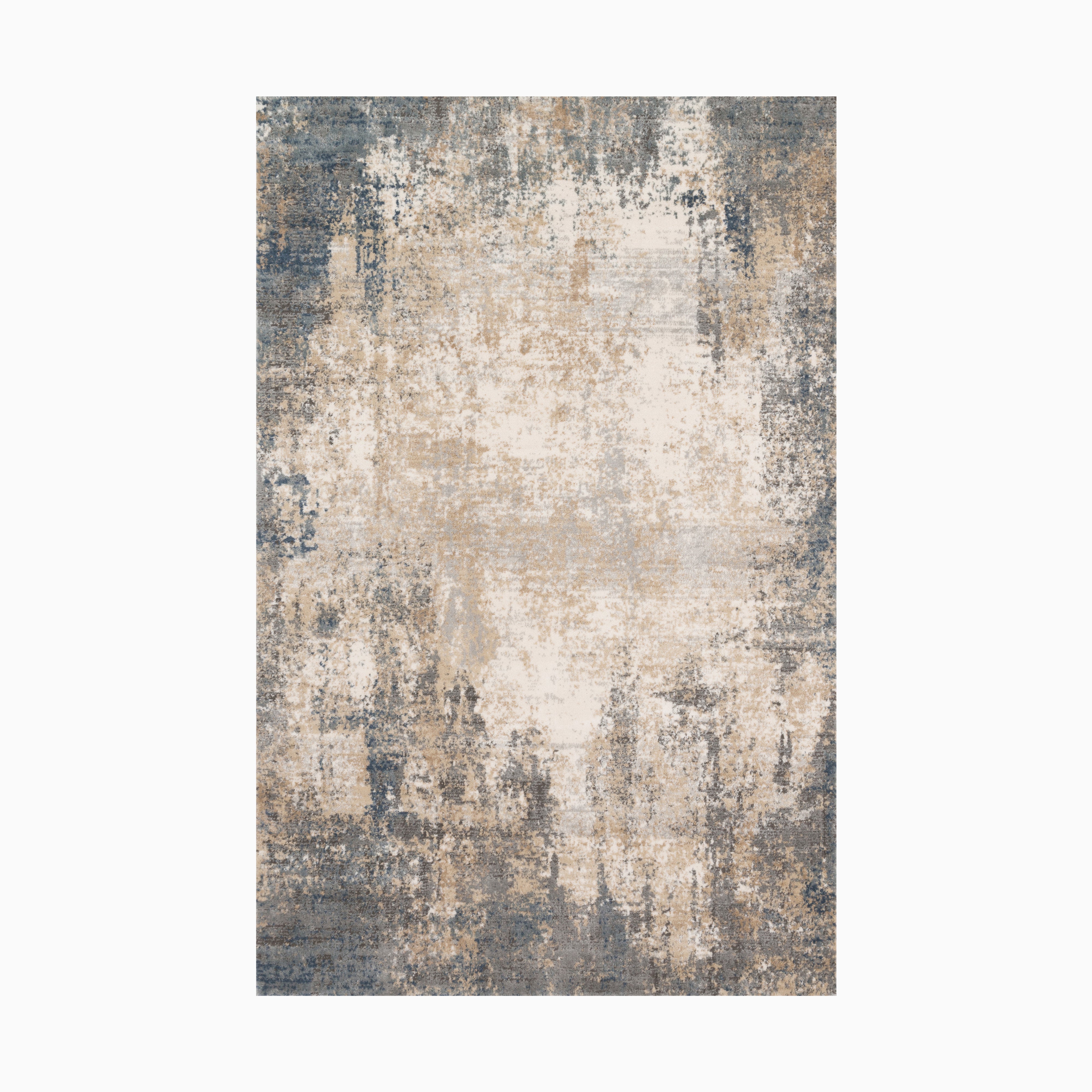 Power loomed area rug made of polypropylene and polyester featuring a distressed design in beige, ivory, and deep blue tones, blending modern style with vintage elegance.