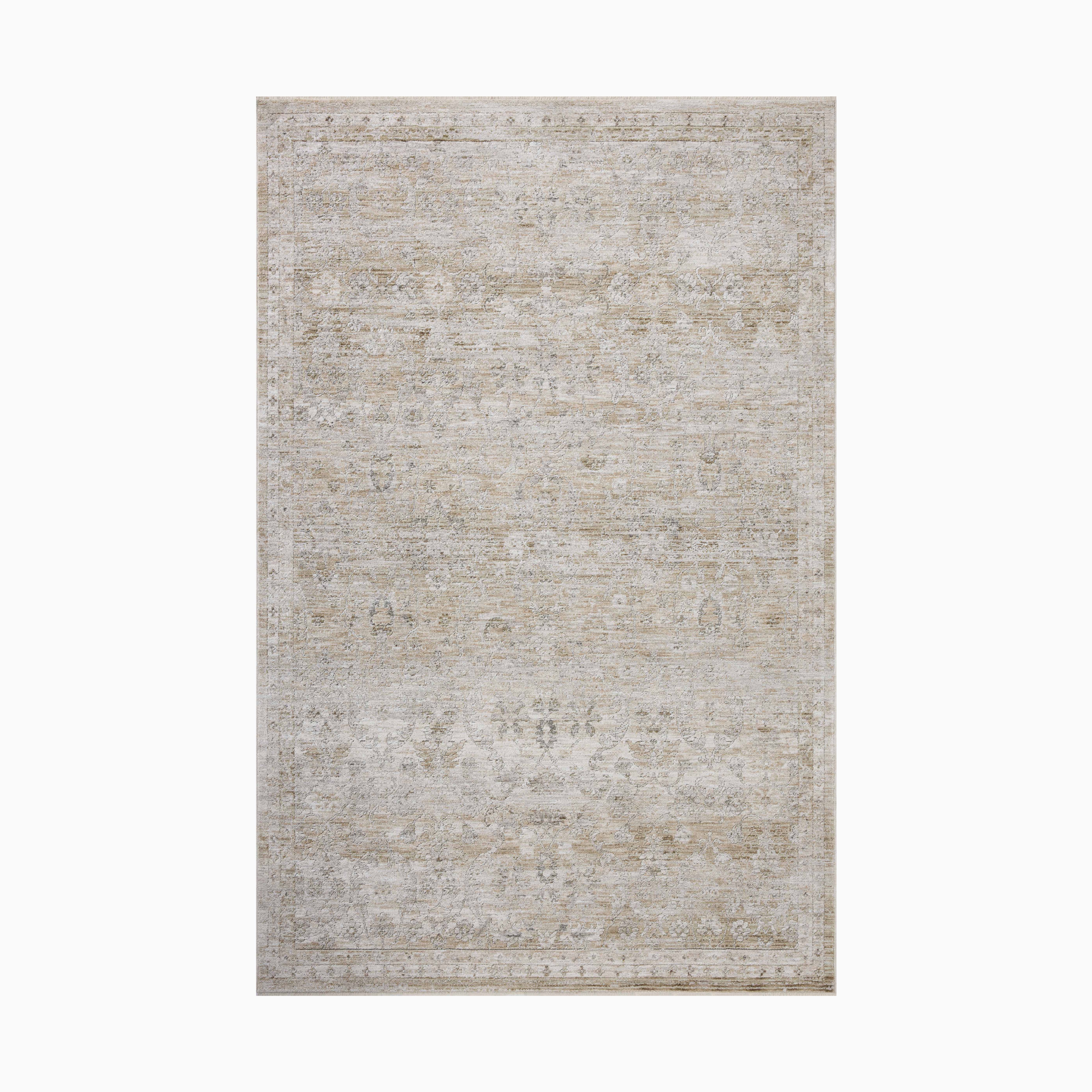 Faded Persian-style power loomed rug in soft beige and ivory tones made of polyester, featuring a distressed medallion pattern for an elegant vintage charm.