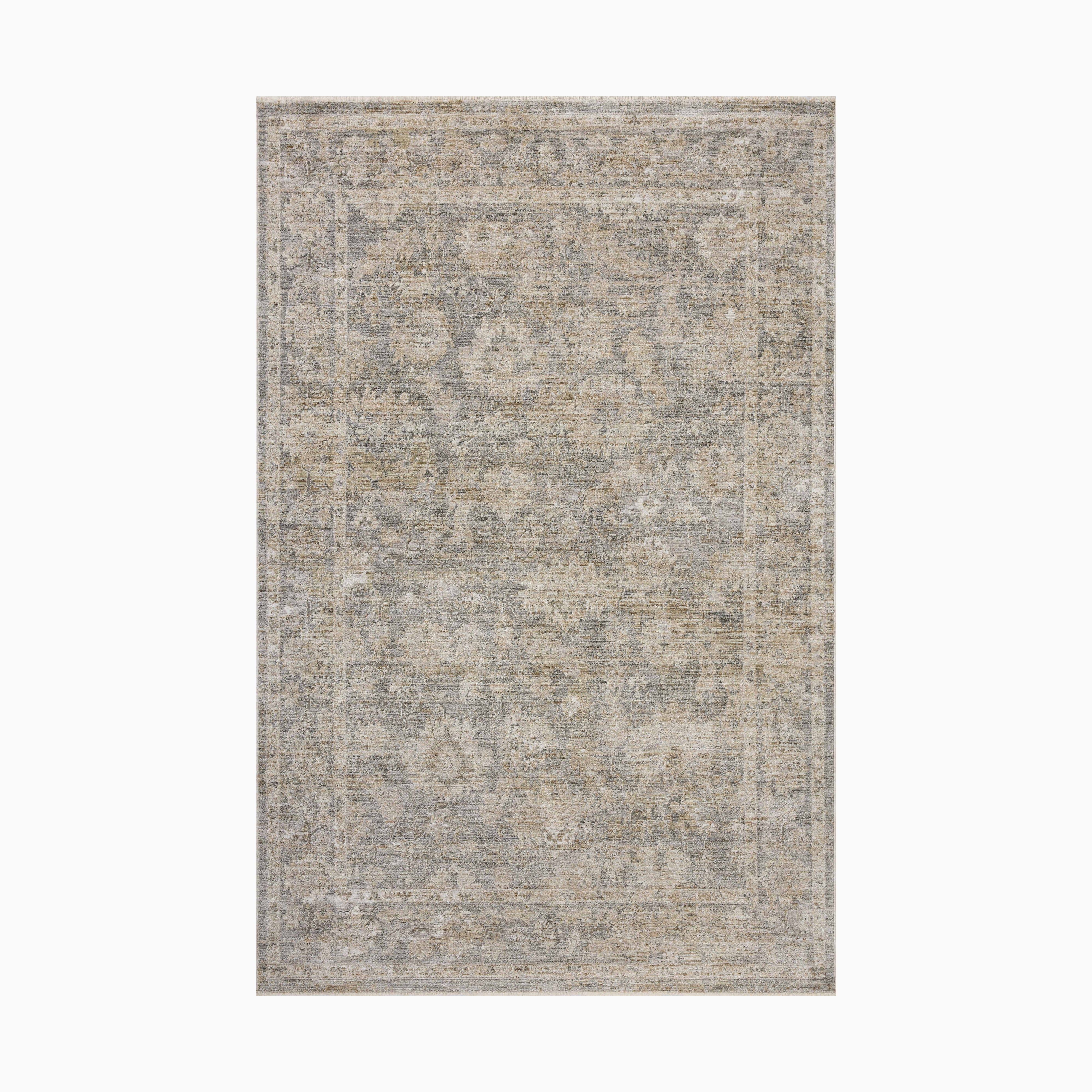 Distressed Persian-style power loomed rug in muted gray and beige tones made of polyester, featuring a faded floral pattern for a sophisticated vintage appeal.