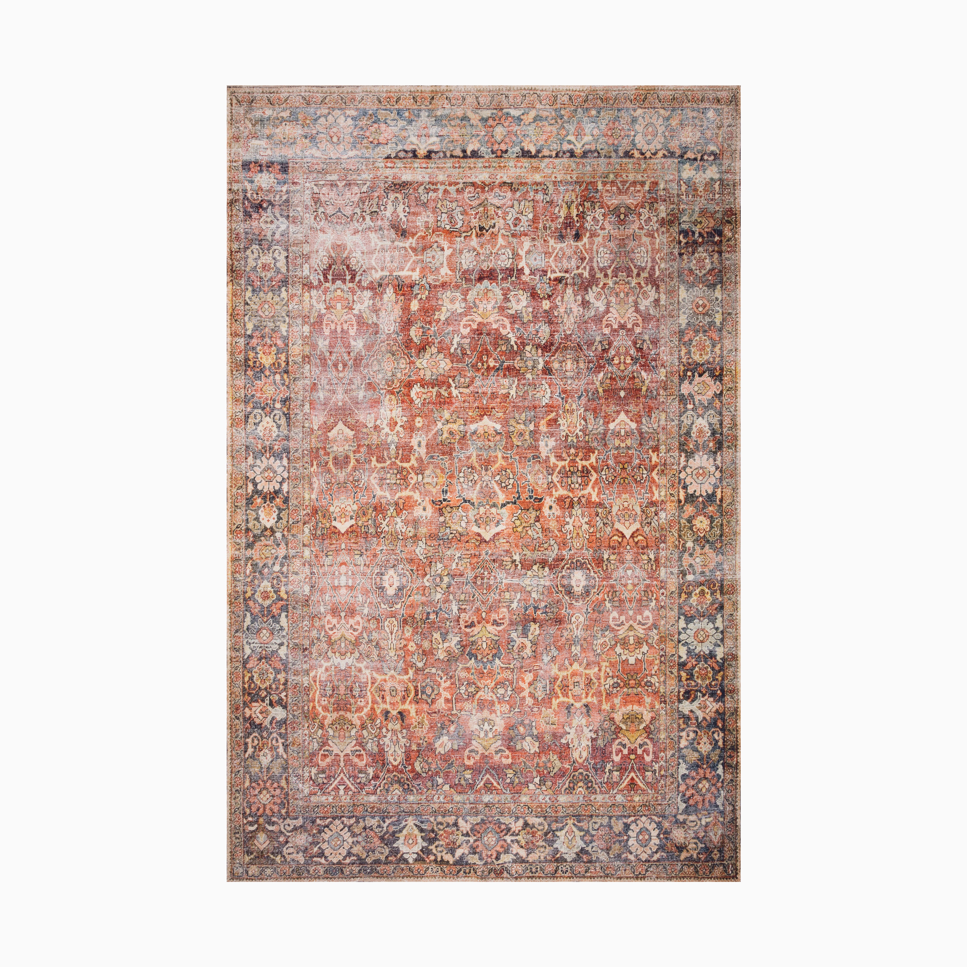 Distressed Persian-style power loomed rug made of polyester, featuring intricate floral motifs in warm rust, beige, and blue hues, framed by an ornate faded border.