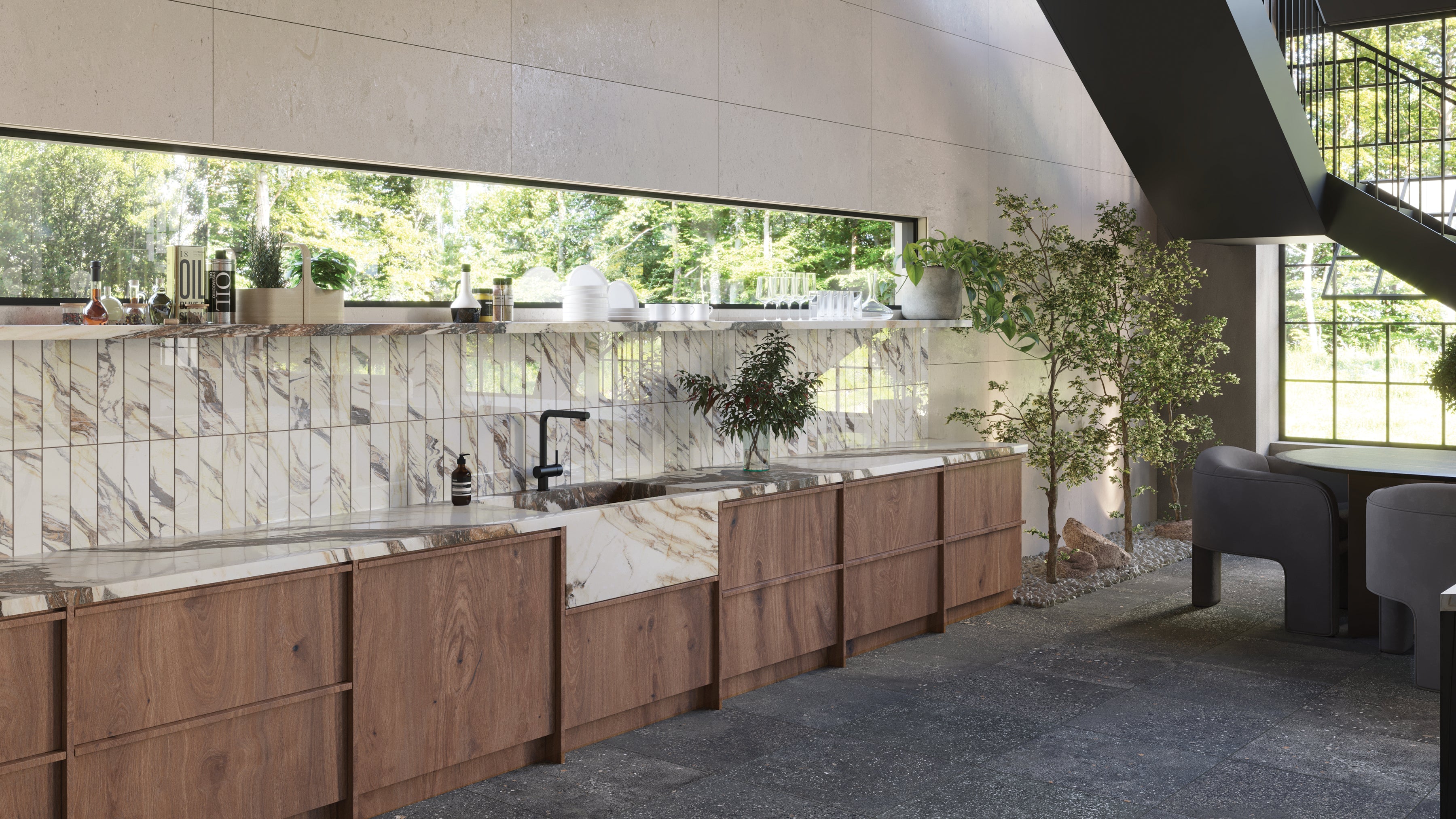 Contemporary kitchen with rich wood cabinetry, polished marble look backsplash, and countertops featuring elegant veining, complemented by large windows and greenery.