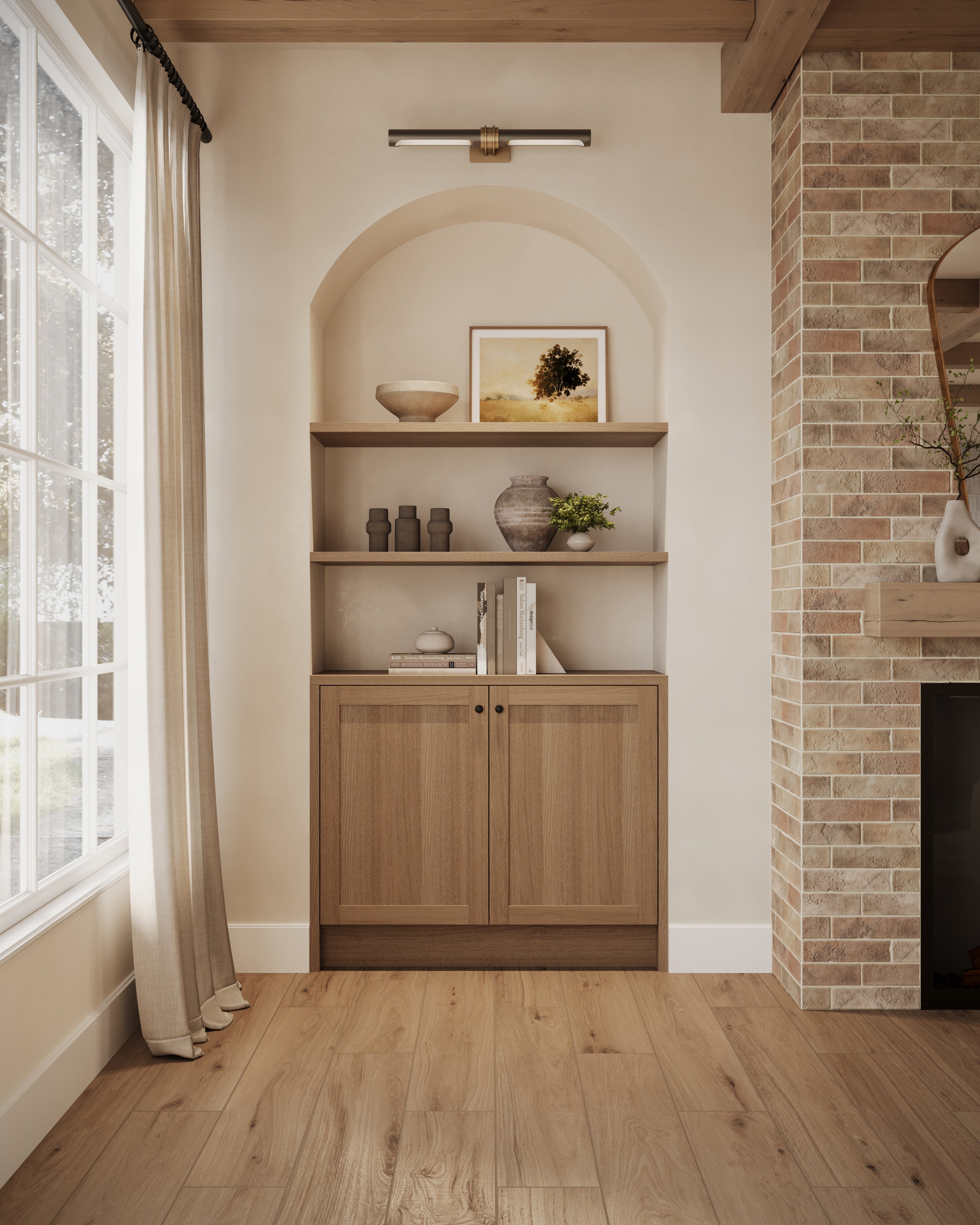 Built-in arched shelving with wood cabinetry and curated decor accents beside a fireplace clad in almond-colored brick wall tiles for added warmth and character.