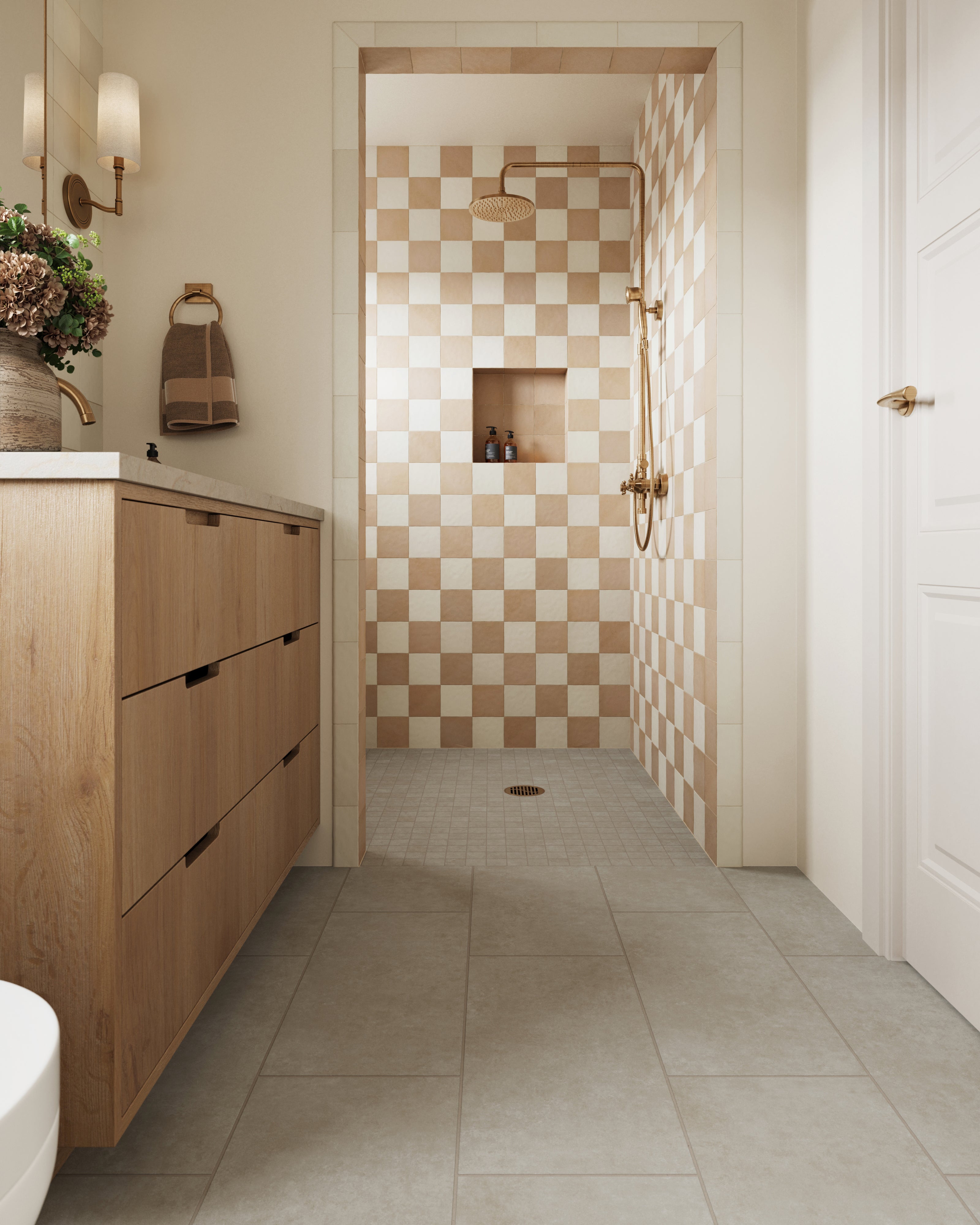 Modern bathroom featuring Wyatt Ash 12x24 matte porcelain tiles on the floor, paired with a checkered shower wall design and warm wood and brass accents for a cozy yet elegant look.