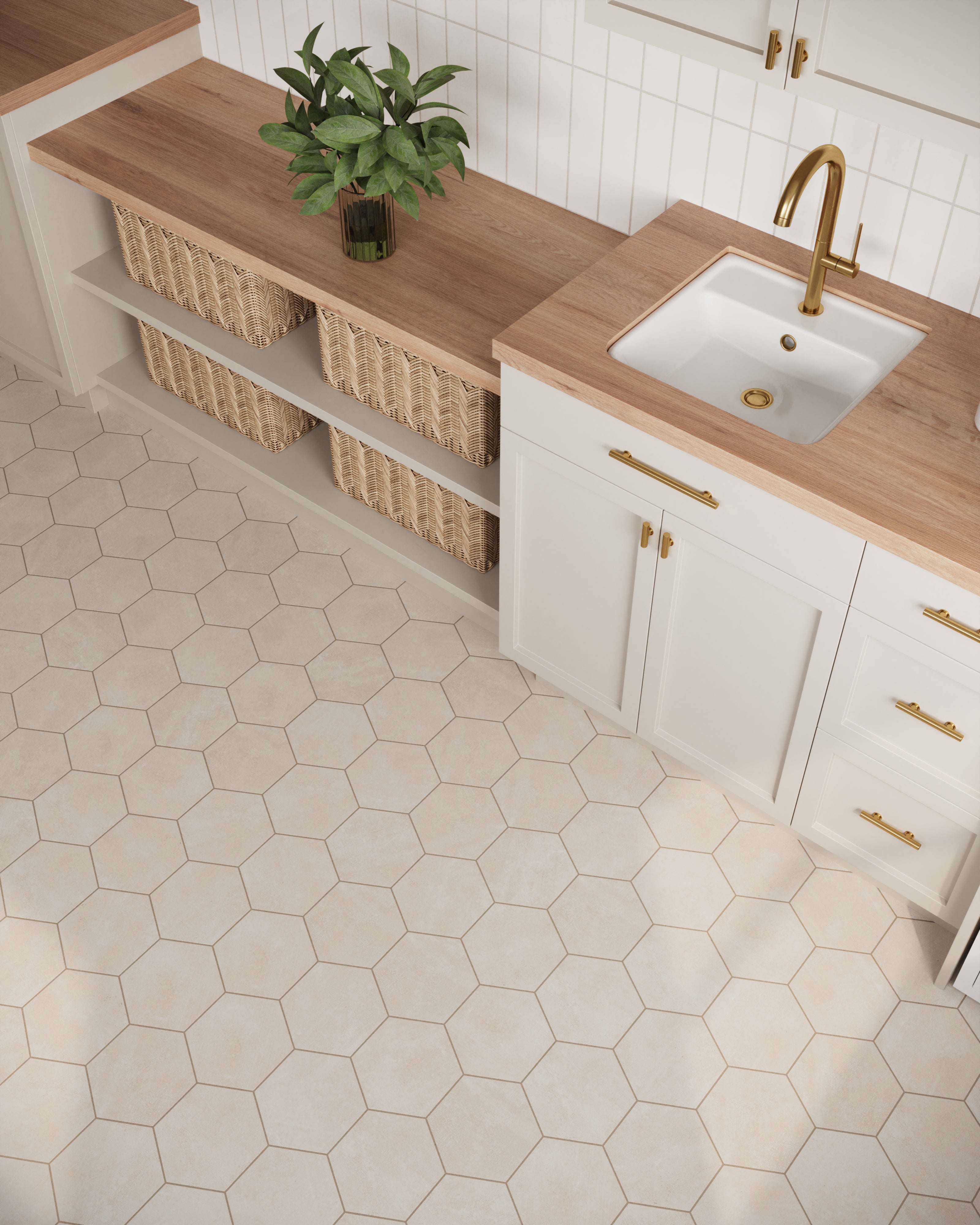 Chic beige hexagonal tiles in a matte finish, complementing the warm wood countertops and brass fixtures in this cozy kitchen