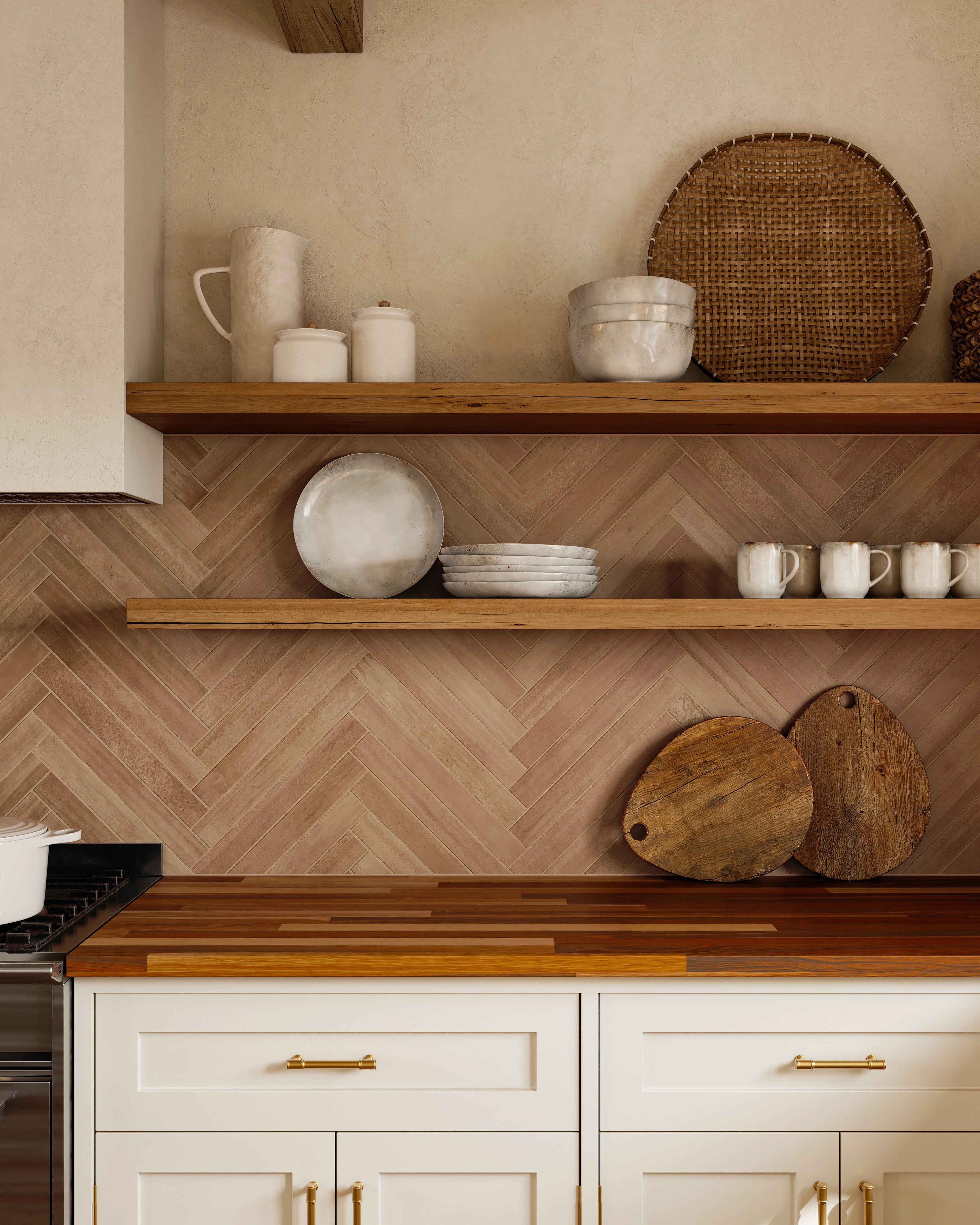 Rustic kitchen detail with terracotta herringbone backsplash, floating wood shelves, and mixed-tone butcher block countertop.