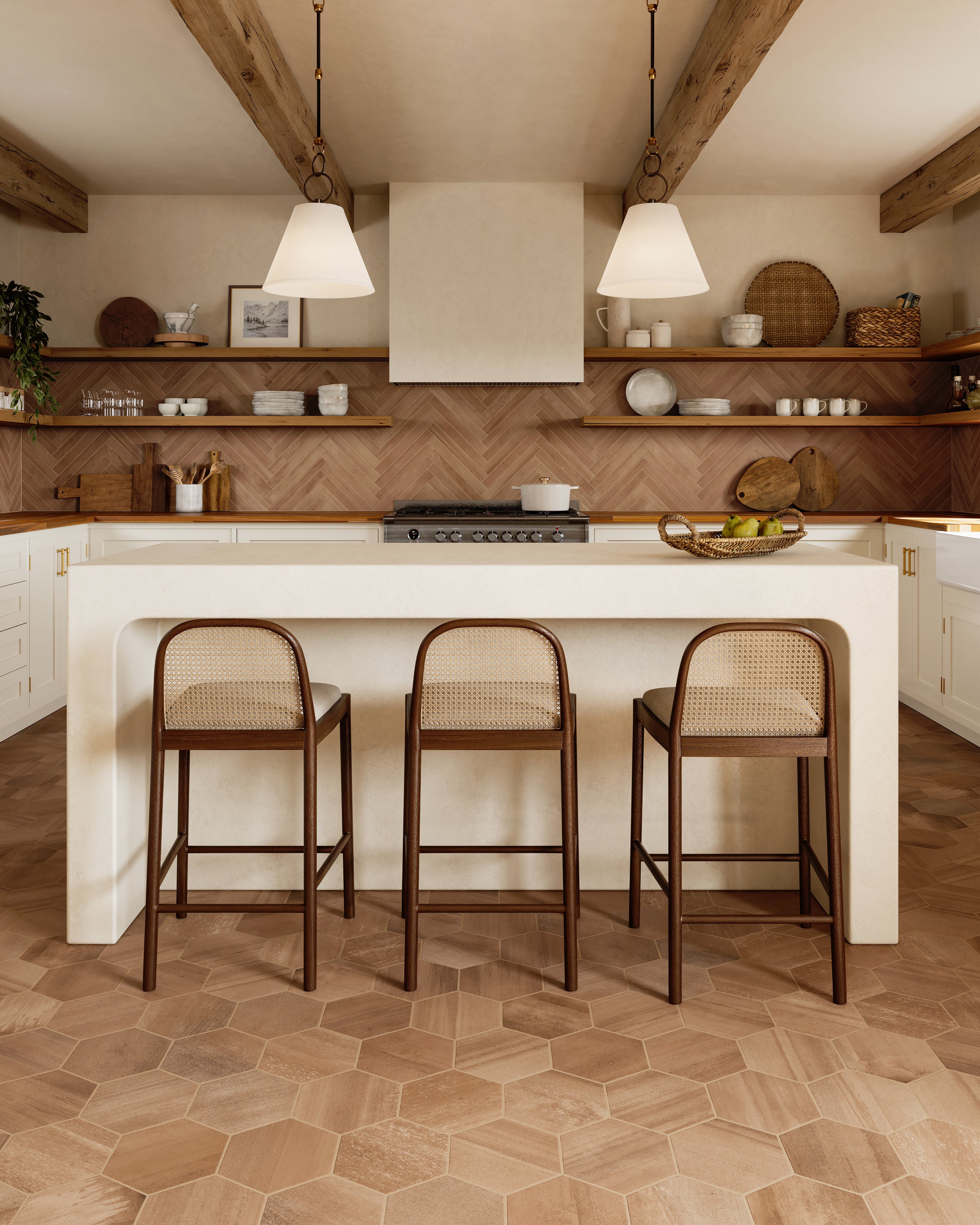 Inviting kitchen with honey-toned hexagon floor tiles, a creamy island with wood stools, and a terracotta herringbone backsplash.