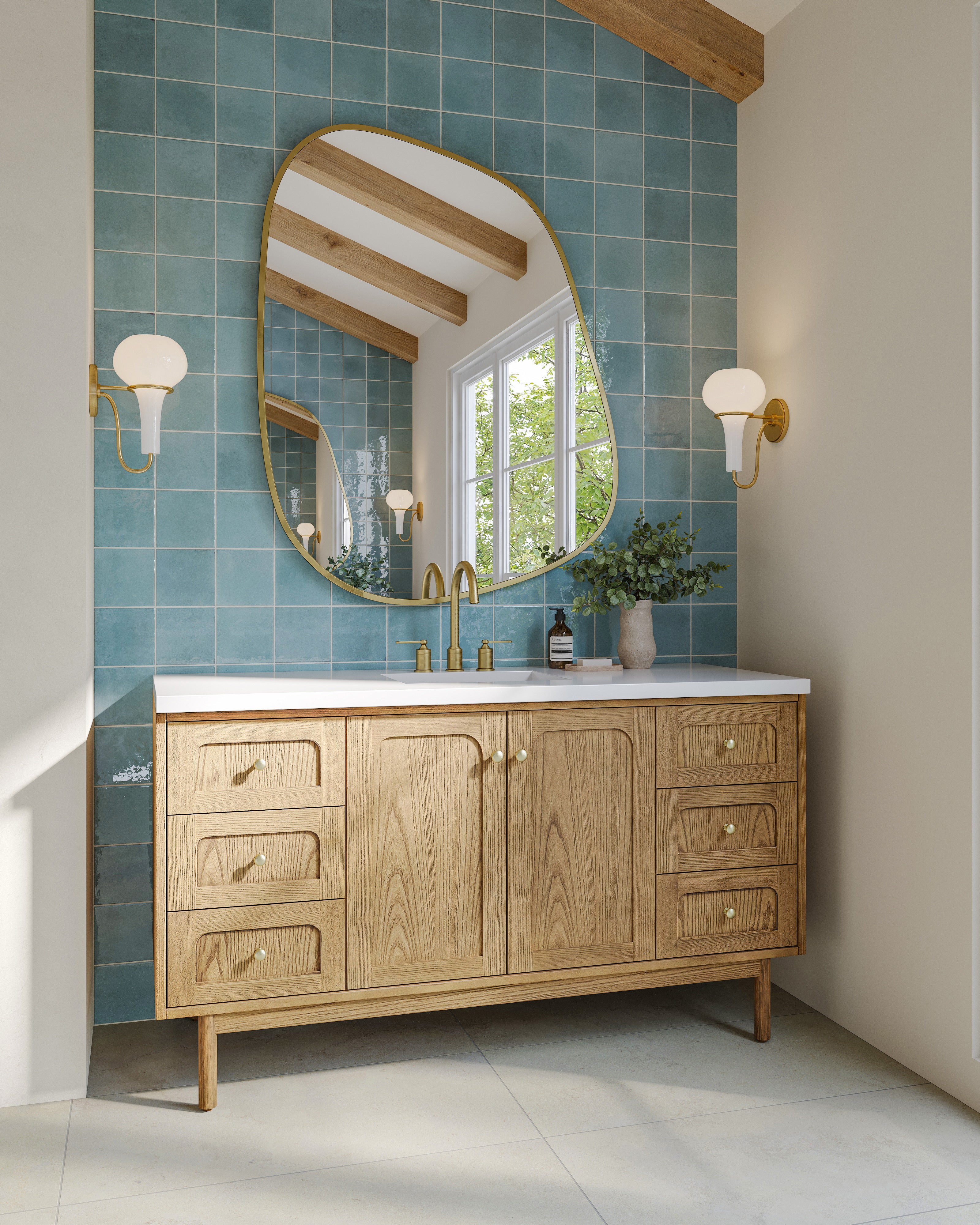 Bathroom vanity with wood cabinetry framed by light blue porcelain tile backsplash featuring a handcrafted, weathered look.