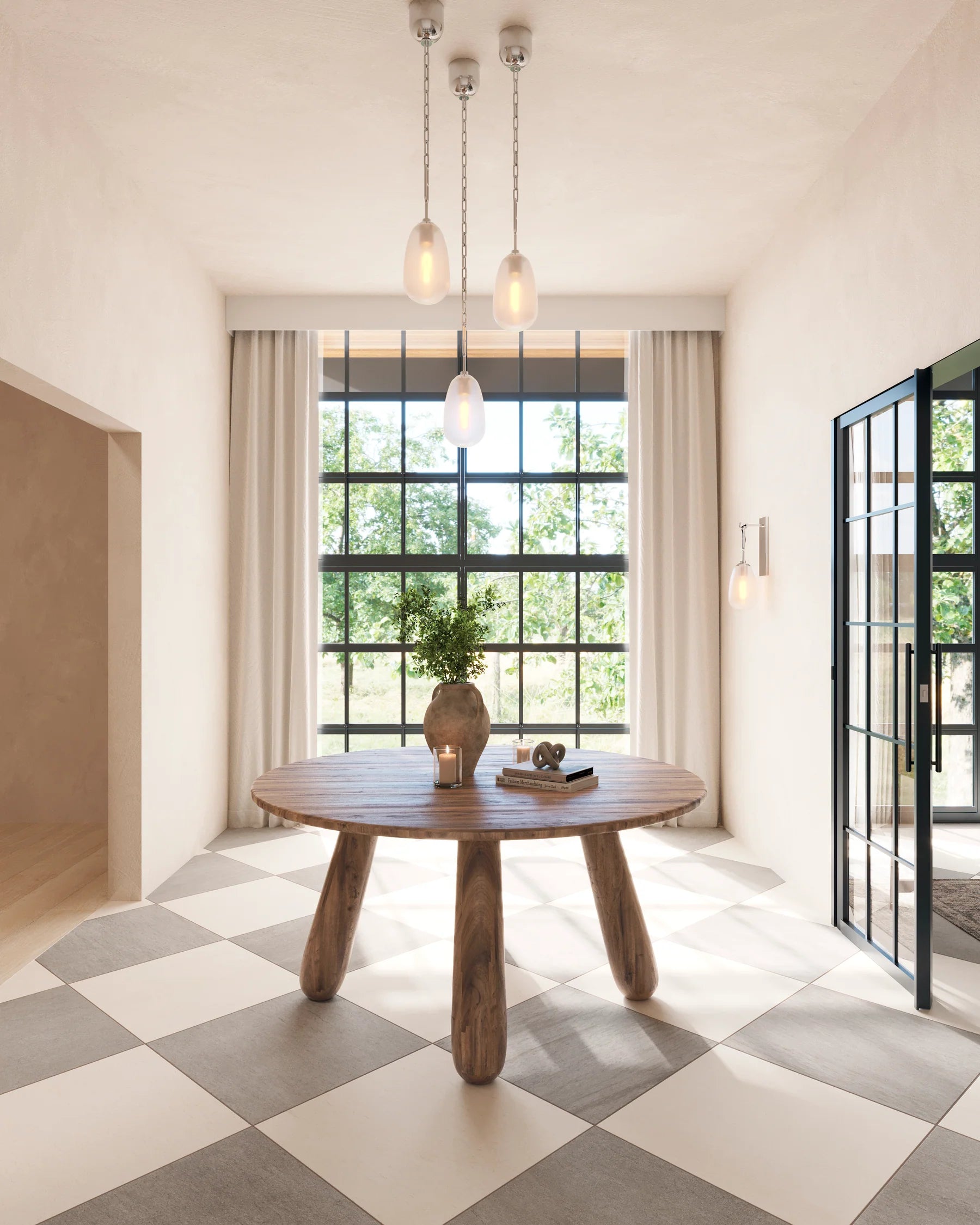 Bright entryway featuring a round wood table with sculptural legs, checkered tile flooring, sheer drapes, and trio pendant lighting.