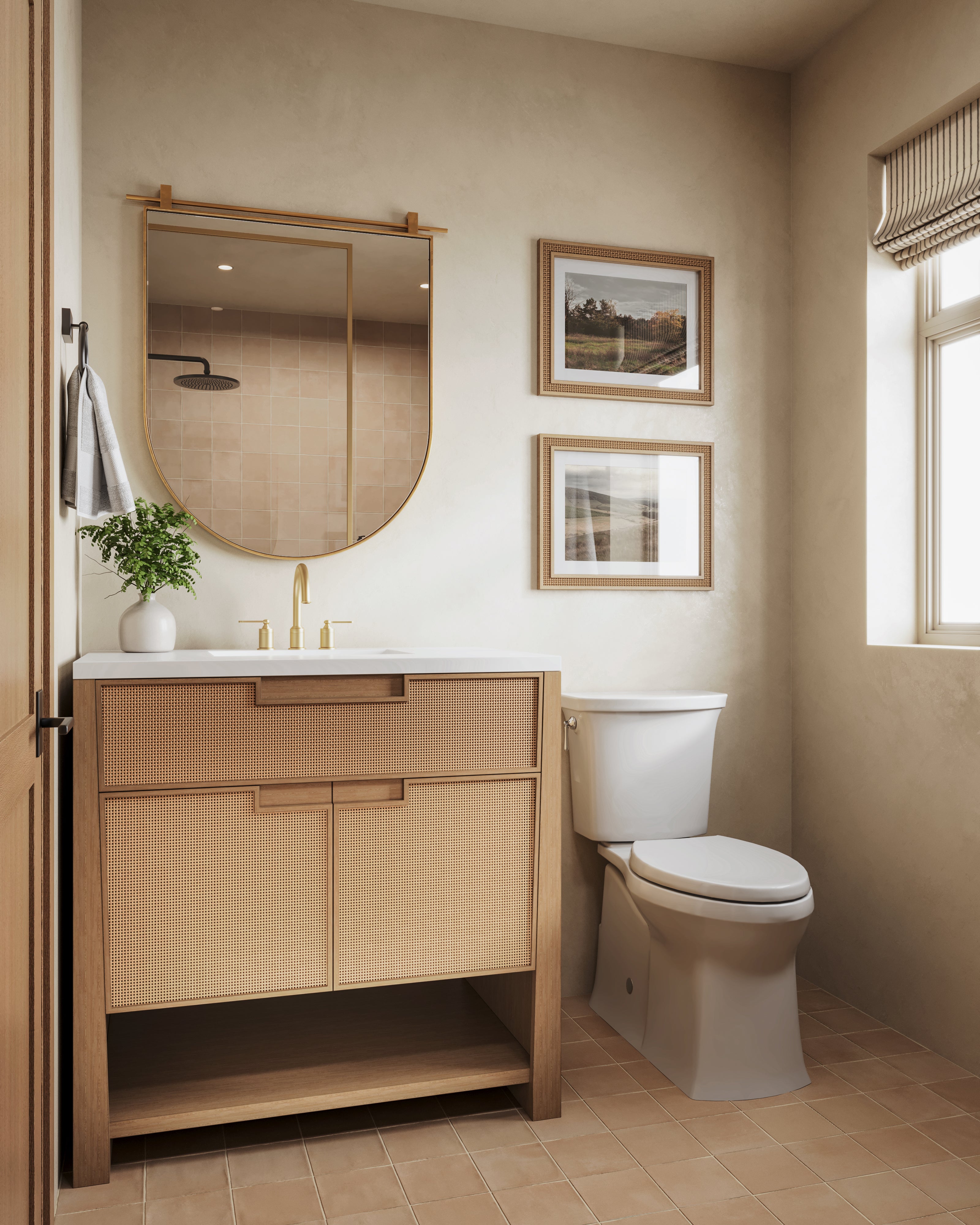 36" Seaside Oak vanity with white quartz top and cane panel doors, styled in a warm bathroom with brass fixtures and framed art.