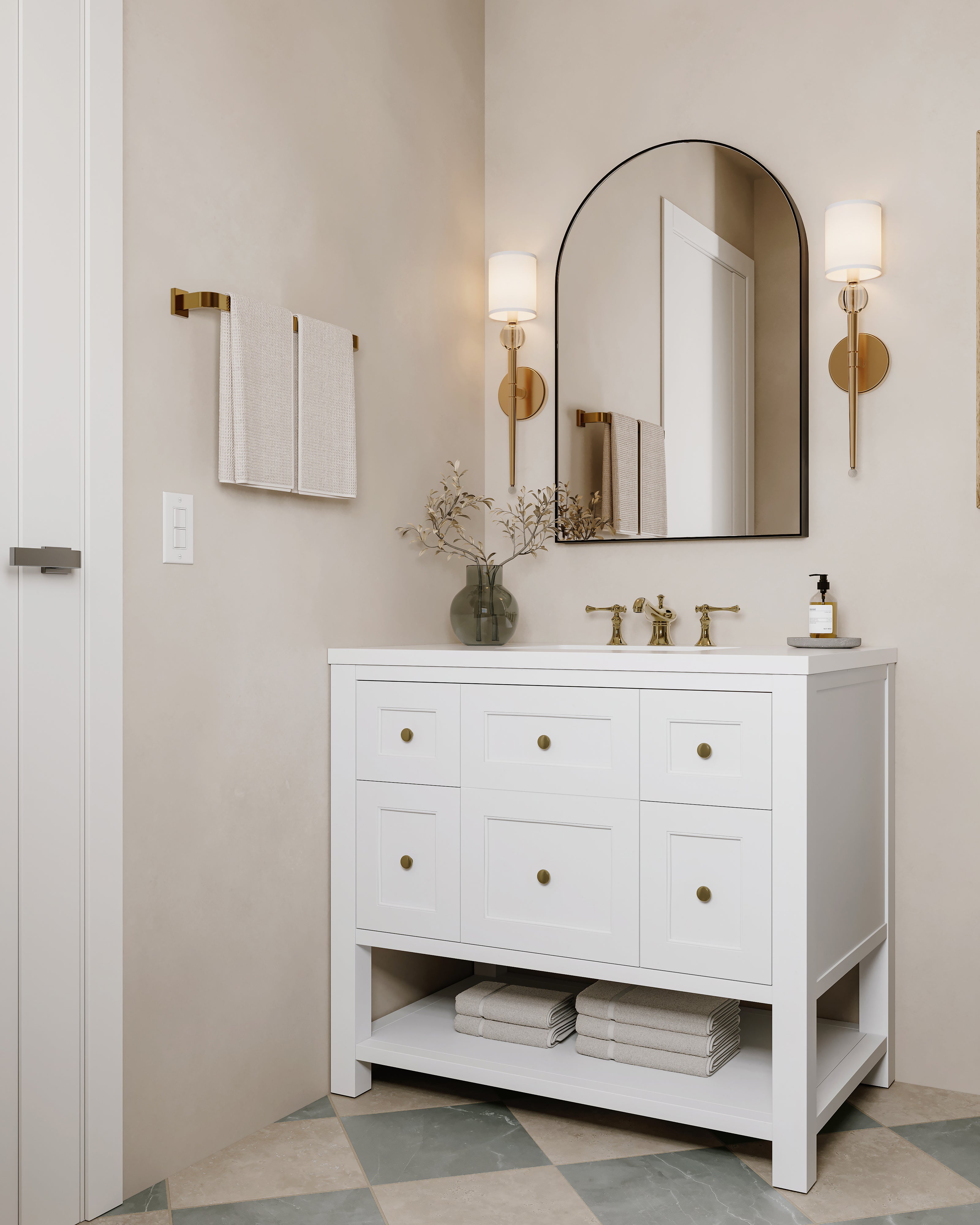 Bridgette 36" bright white single vanity with champagne brass knobs, white quartz top, and open shelf, styled in a neutral bath with checkerboard floor.