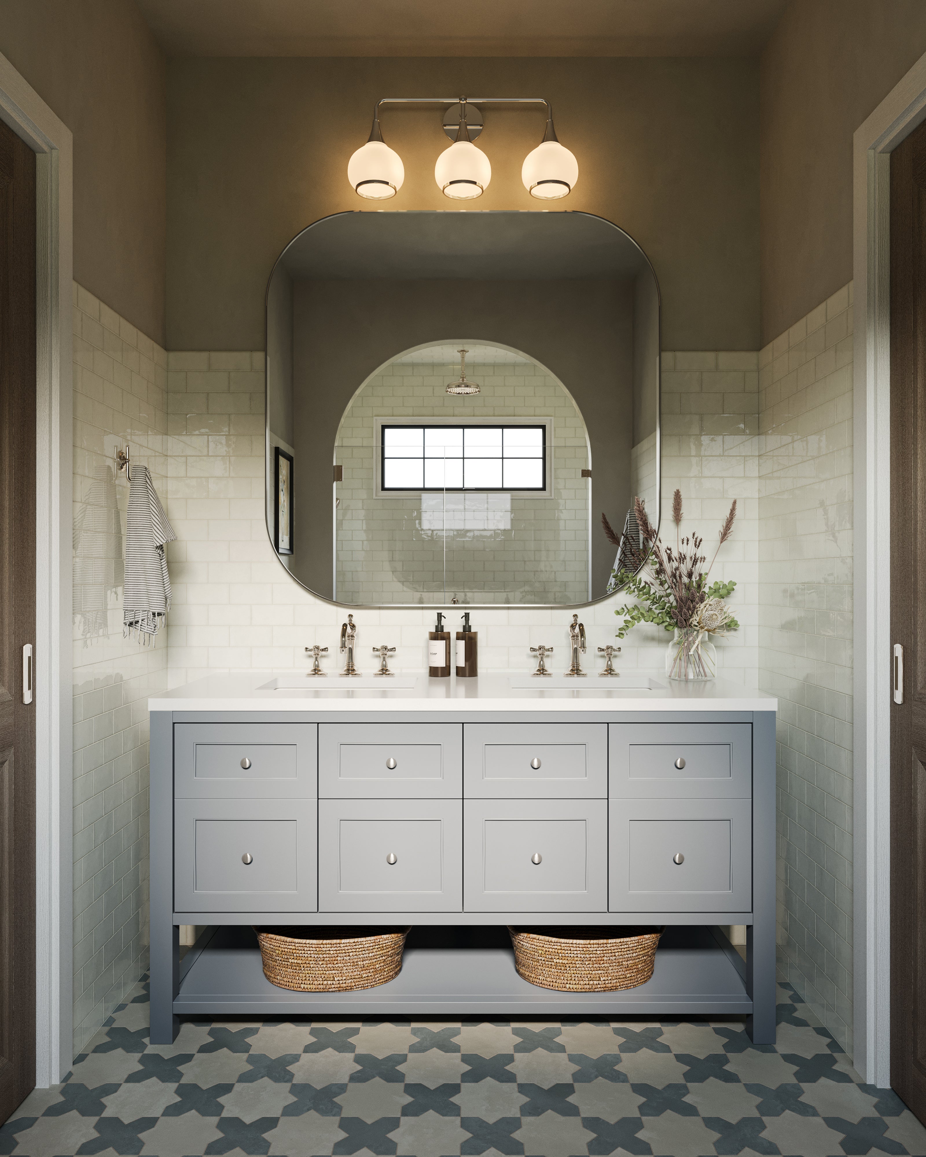 Bridgette 60" double vanity in Serenity Blue with paneled drawers and round knobs, open lower shelf with woven baskets, and a 3 cm White Zeus quartz countertop with dual sinks and brushed metal faucets, set beneath a large rounded mirror and three-light vanity fixture against glossy white subway tile walls.