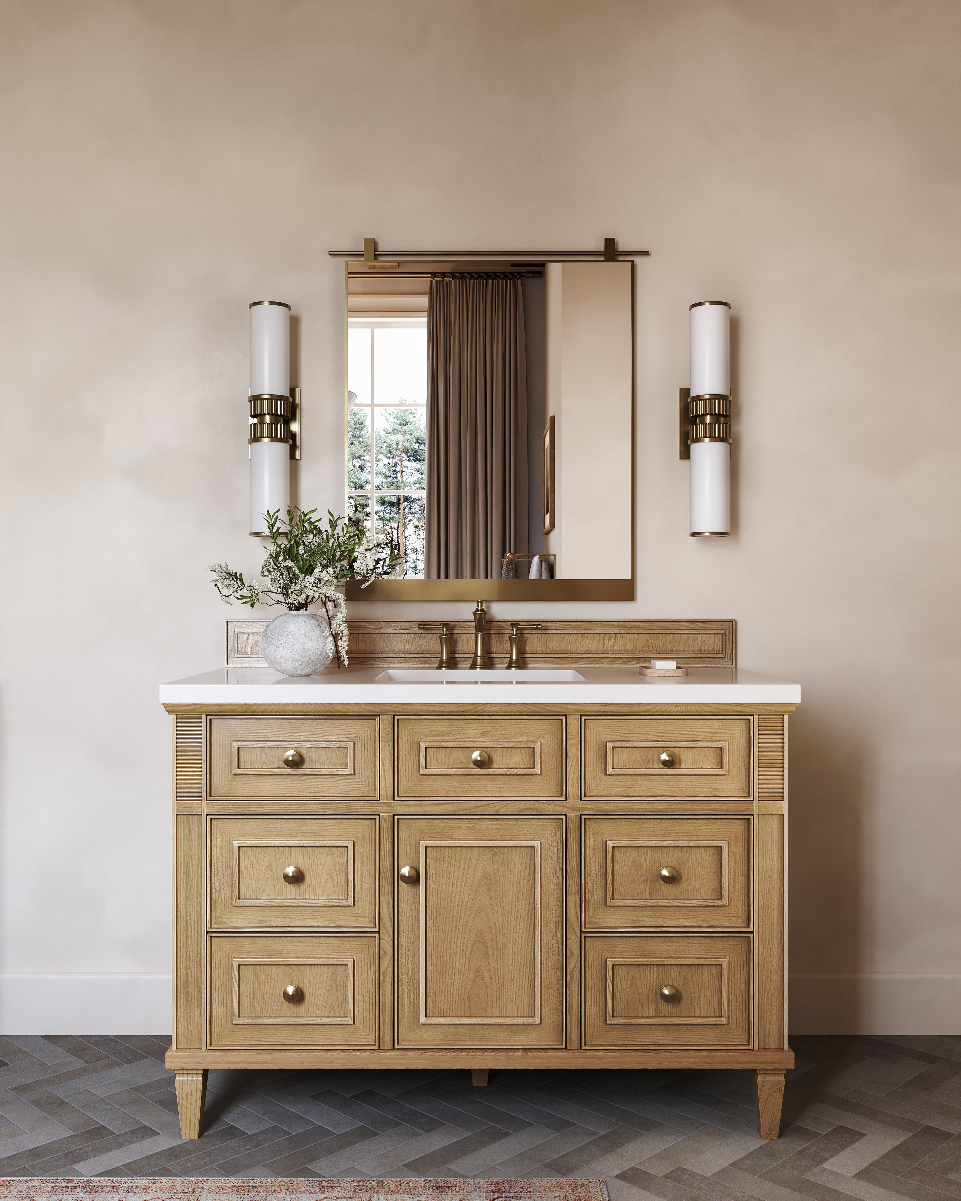 Elodie 48-inch single vanity in light natural oak with White Zeus quartz countertop, styled with a brass mirror, dual wall sconces, and warm neutral bathroom decor.
