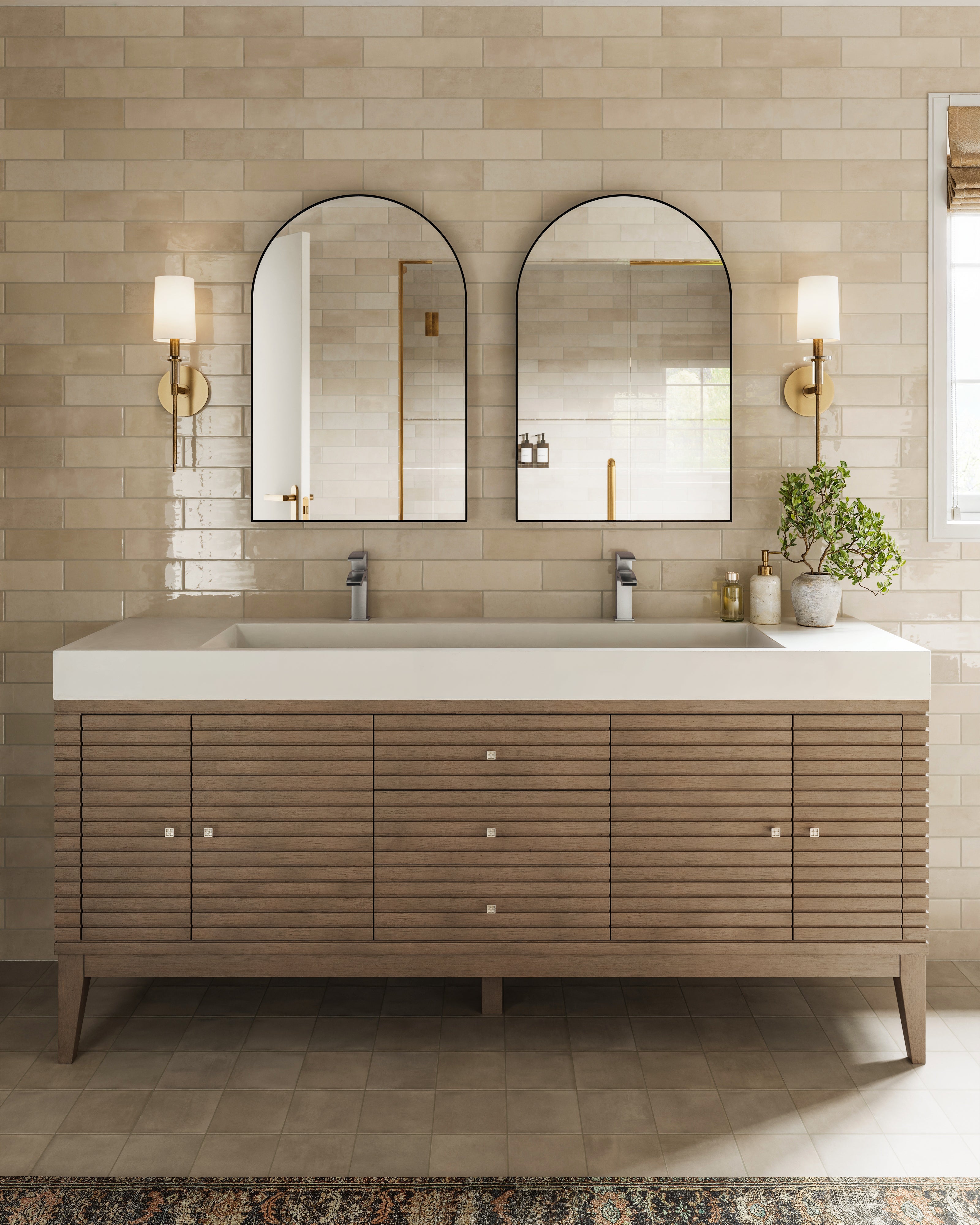Easton 72" double vanity in whitewashed walnut with sleek fluted drawers and white composite stone integrated countertop, styled in a beige tiled bathroom.