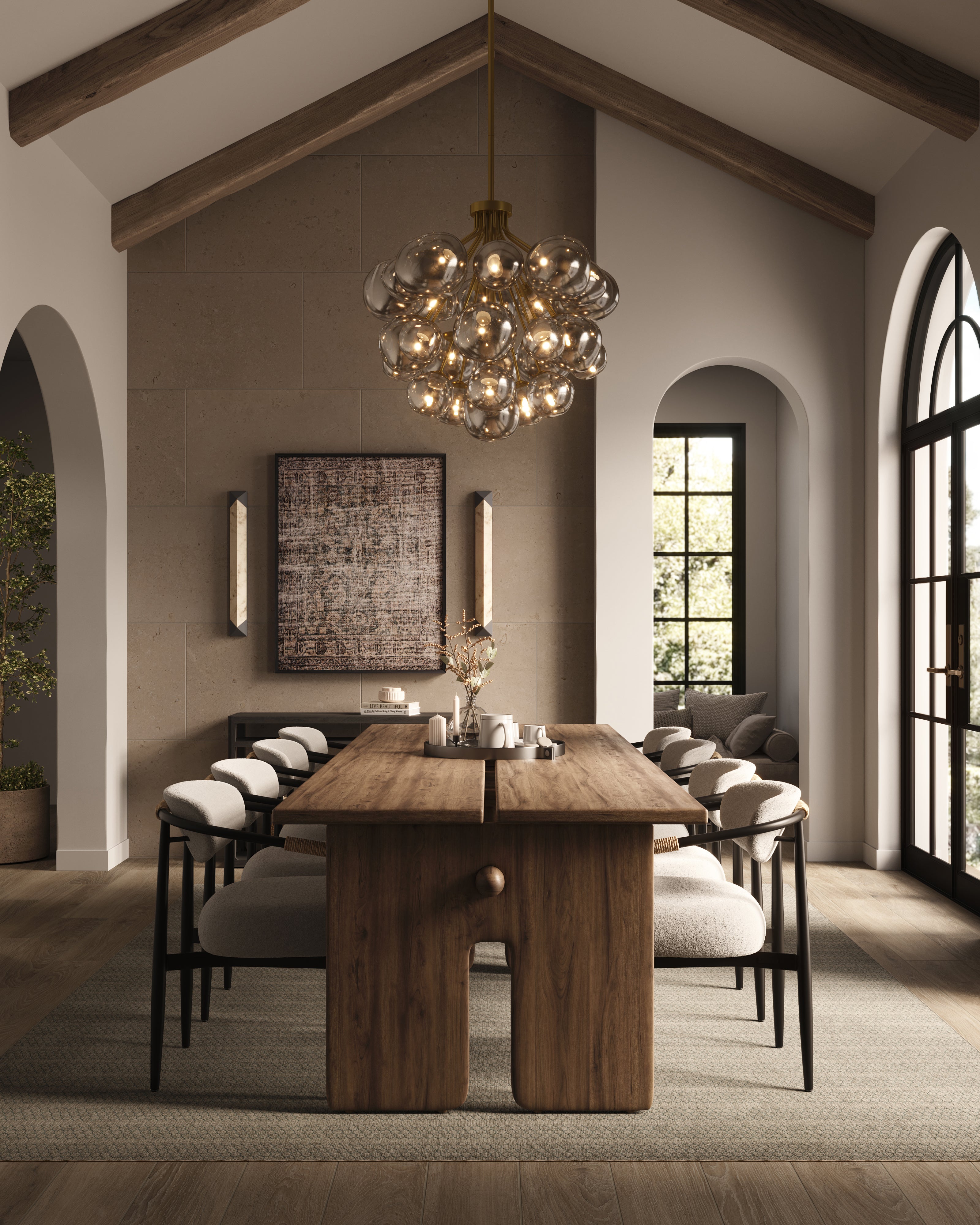 Modern dining room with a sculptural wood table, plush curved chairs, globe cluster chandelier, sconces, wall art, and warm neutral tones throughout.
