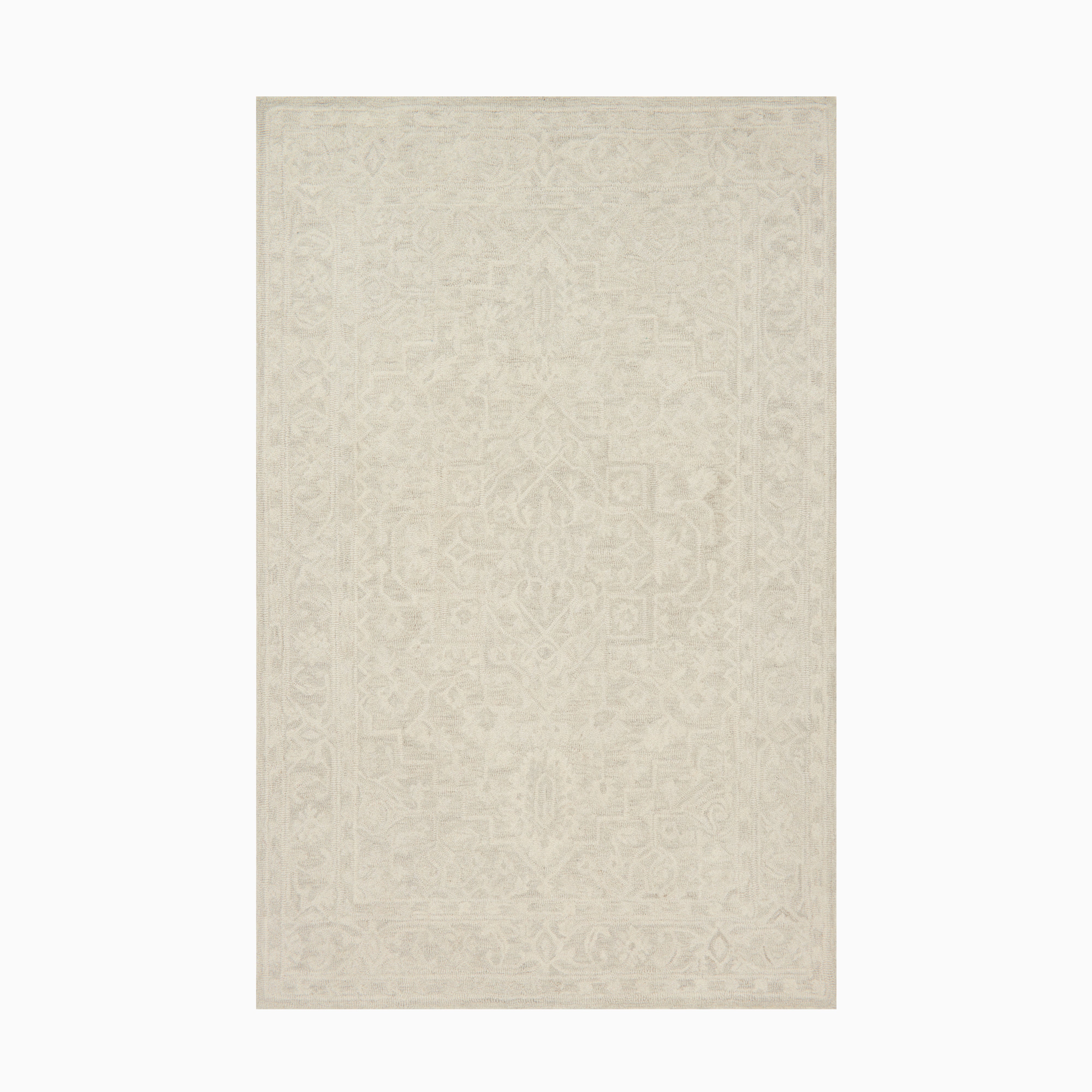 Hand-hooked wool rug in ivory cream, designed with subtle detailing that adds depth and warmth to transitional spaces.