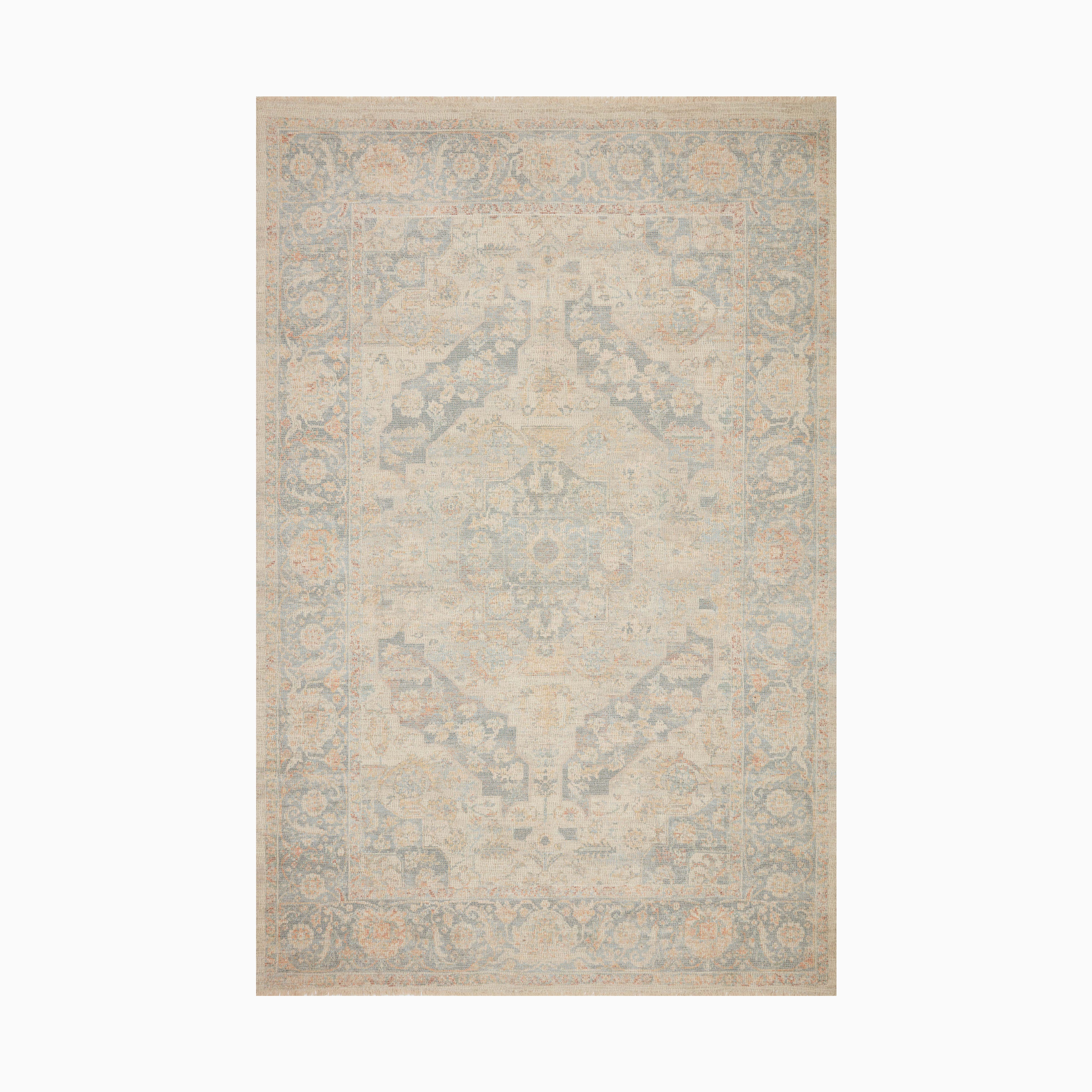 Hand-woven cotton blend rug in soft natural beige with opal blue accents, featuring an intricate transitional pattern for a refined look.