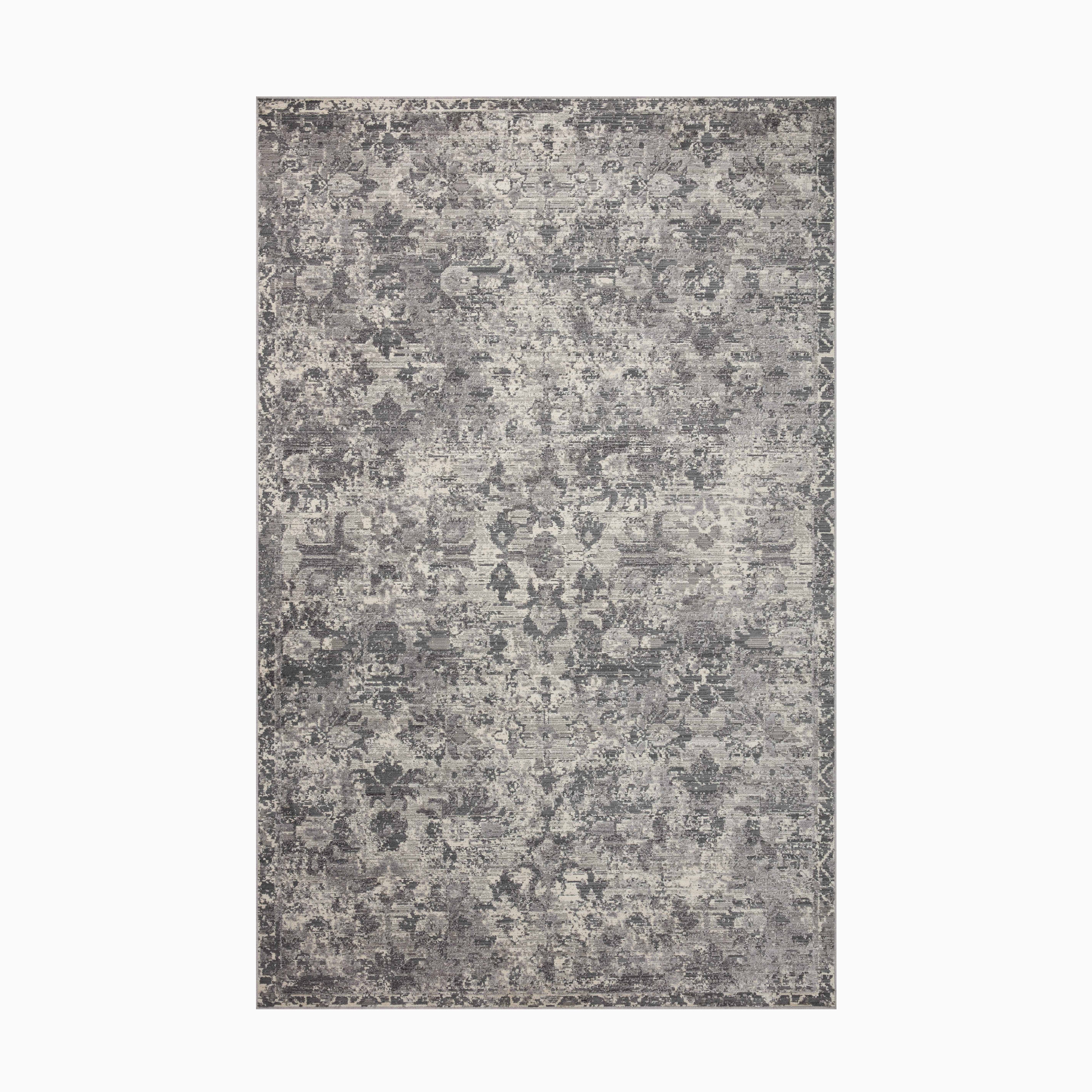 Polyester and polypropylene power-loomed rug in graphite and misty gray hues, blending contemporary design with a subtly distressed finish.
